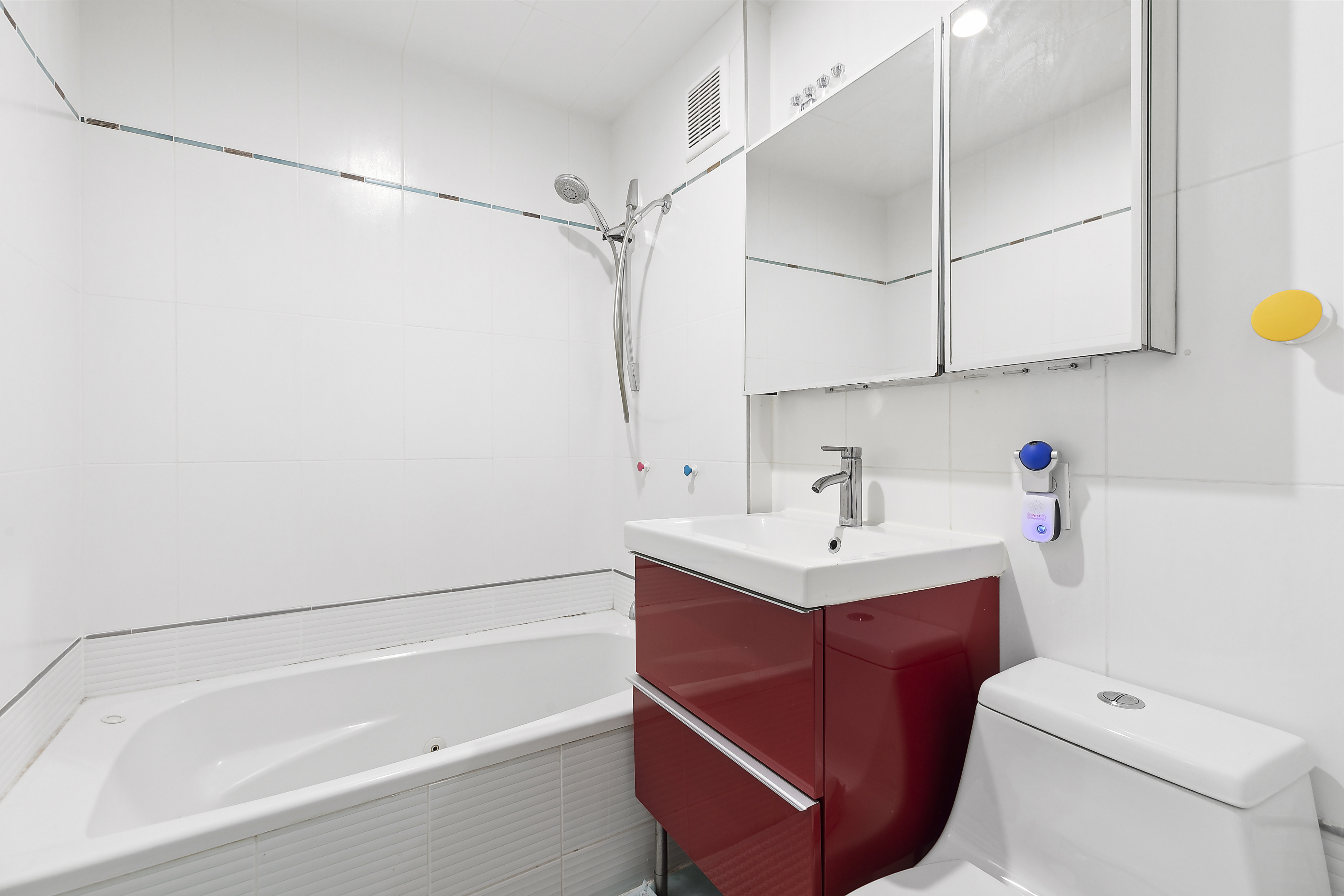 9602 4th Avenue, Unit 4P Brooklyn, NY 11209 - Photo 4 of 6 a bathroom with a sink a toilet and shower