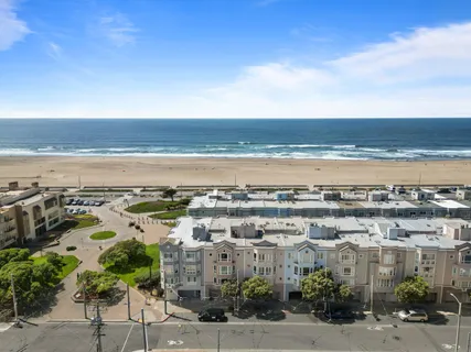 a view of city with ocean