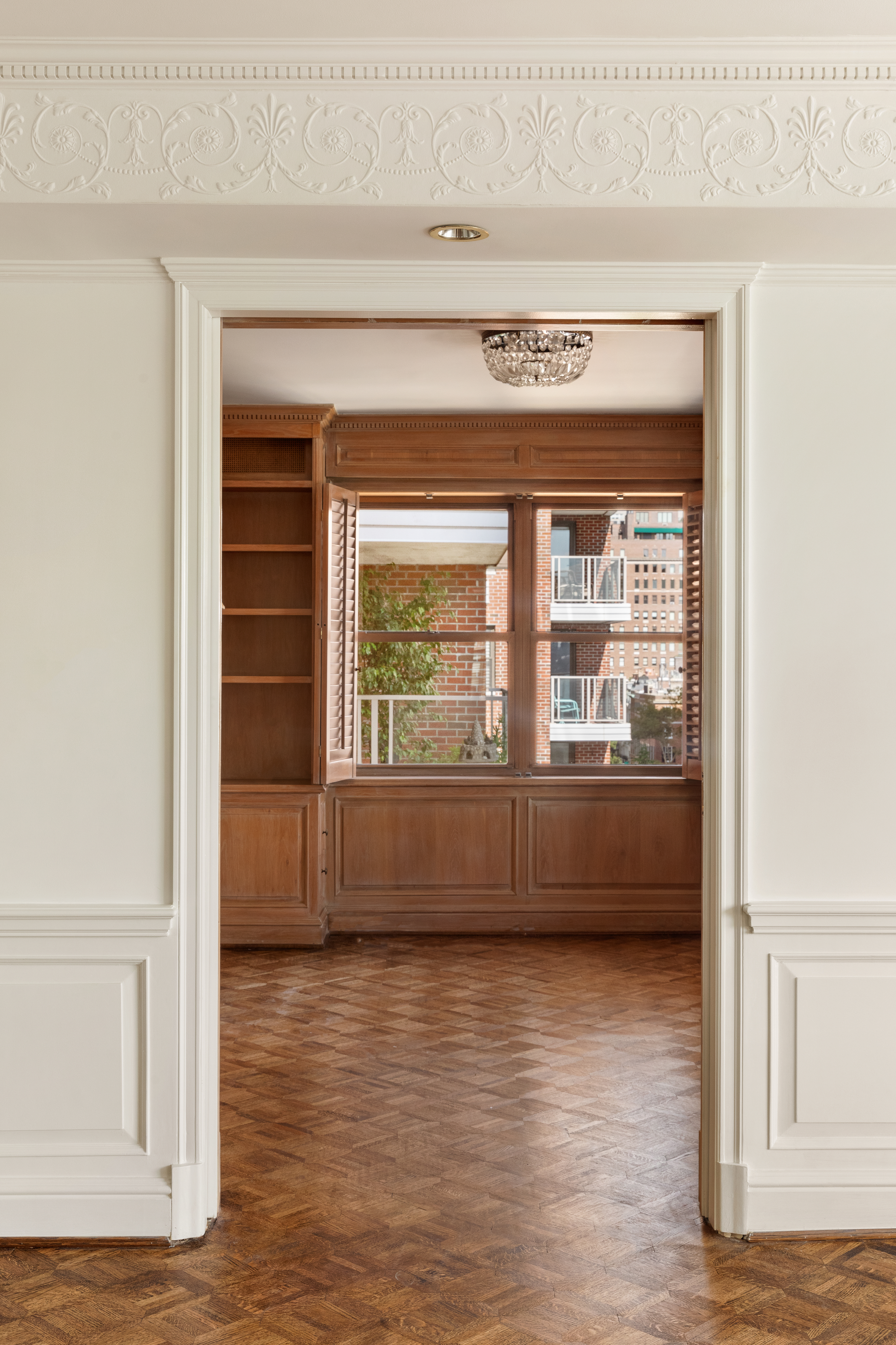50 Sutton Place South, Unit 11H Manhattan, NY 10022 - Photo 4 of 10 a view of room with window and wooden floor