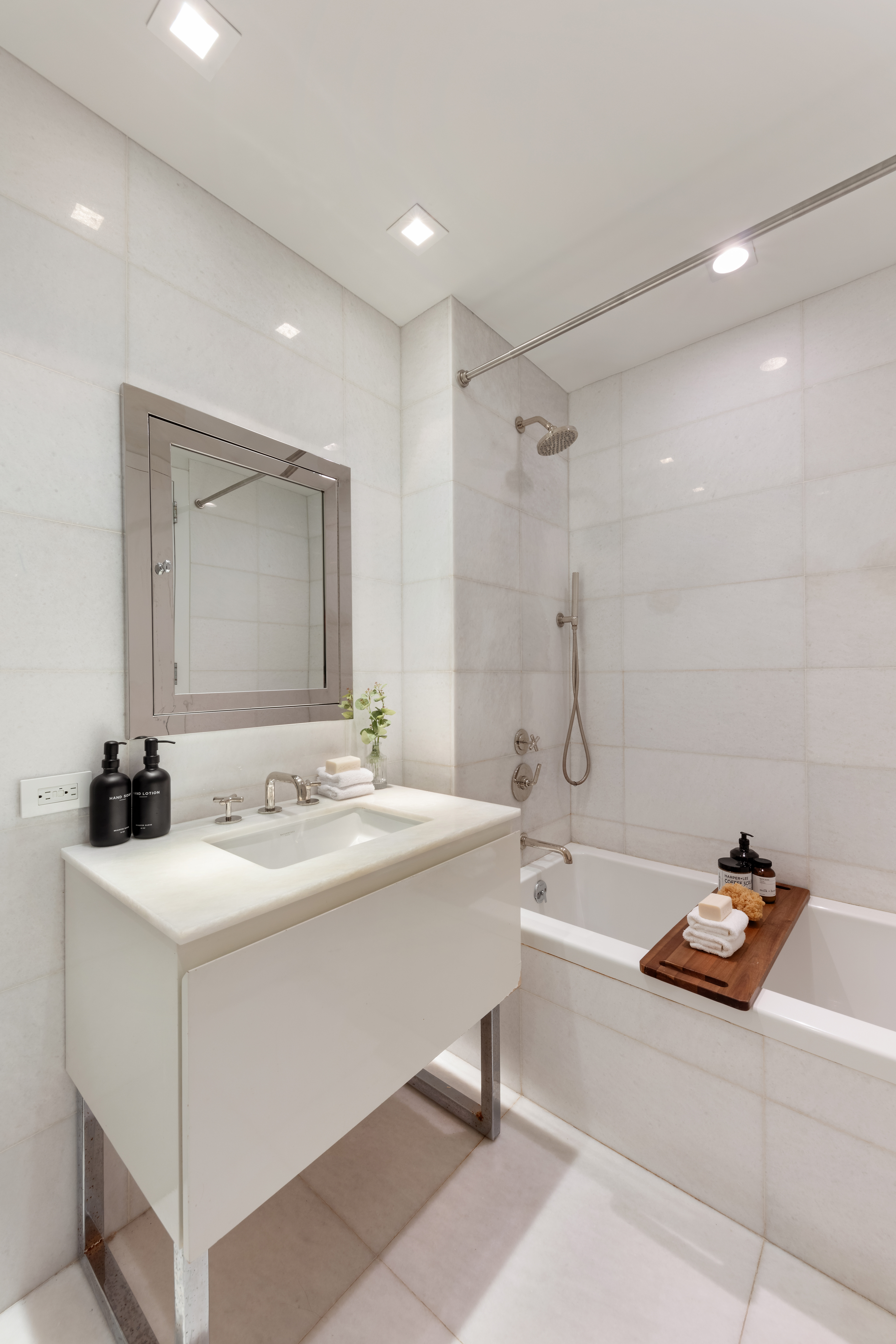 5 Franklin Place, Unit 3A Manhattan, NY 10013 - Photo 7 of 17 a bathroom with a tub sink and mirror
