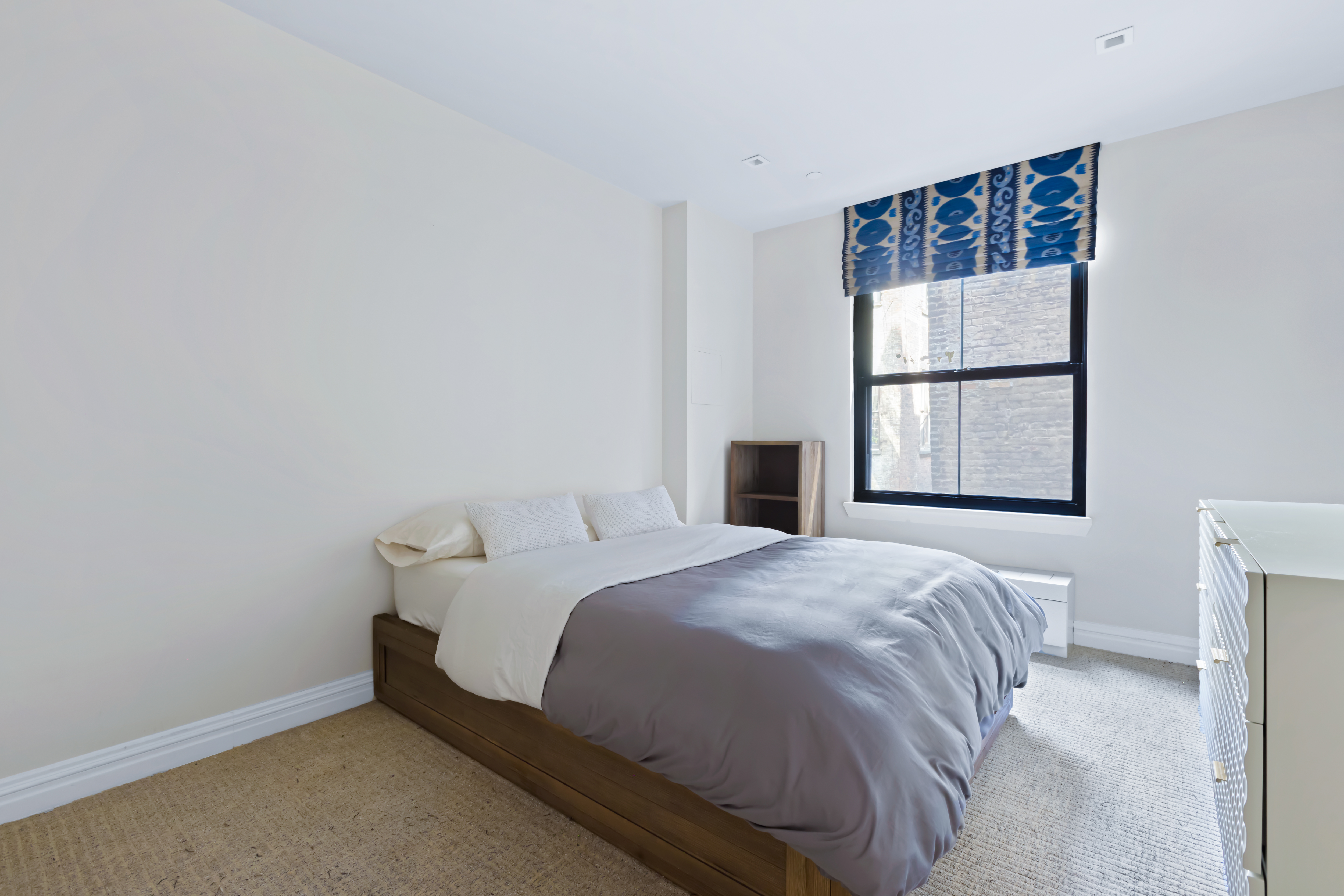 161 Duane Street, Unit 4B Manhattan, NY 10013 - Photo 9 of 12 a bedroom with a bed and a window