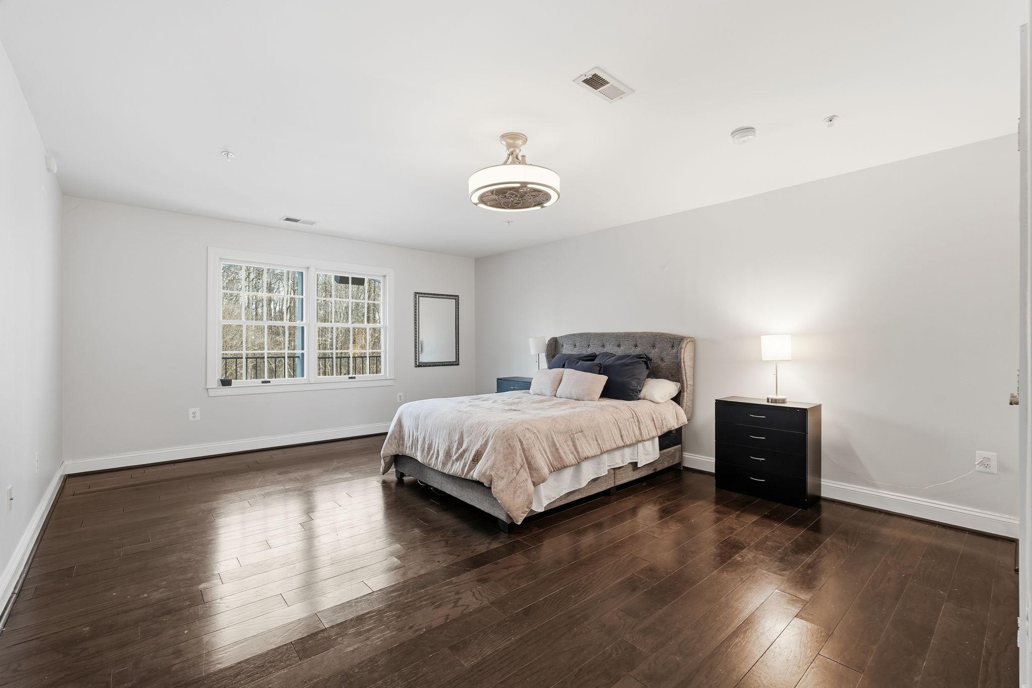 11000 Brooks Reserve Road Upper Marlboro, MD 20772 - Photo 32 of 60 a spacious bedroom with a bed and wooden floor