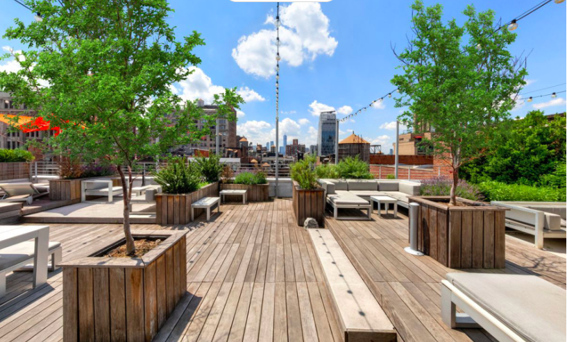 16 West 19th Street, Unit 3A Manhattan, NY 10011 - Photo 8 of 10 a view of a balcony with chairs potted plants and a large tree