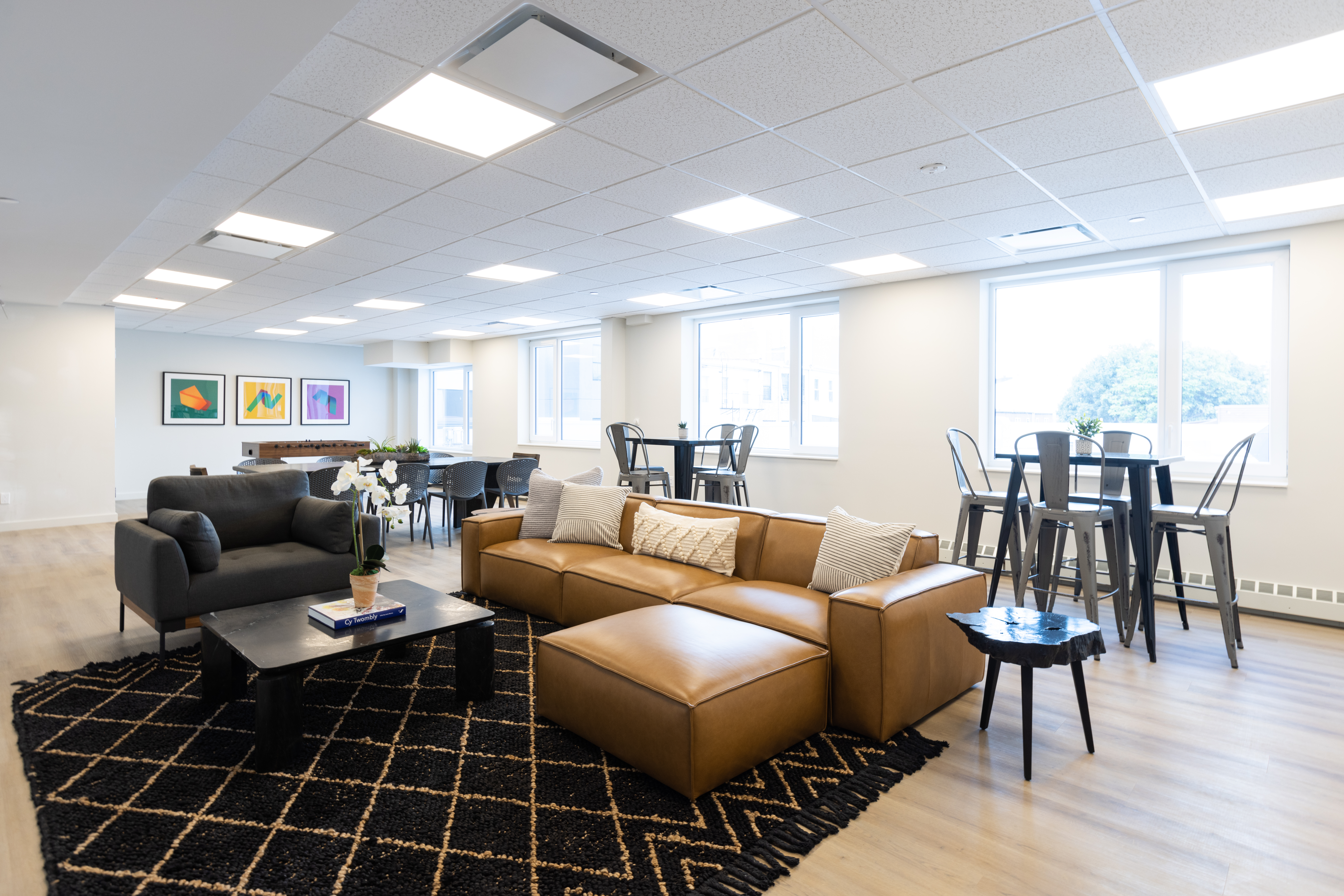 8 Palmetto Street, Unit 305 Brooklyn, NY 11221 - Photo 7 of 20 a living room with furniture a wooden floor and a large window