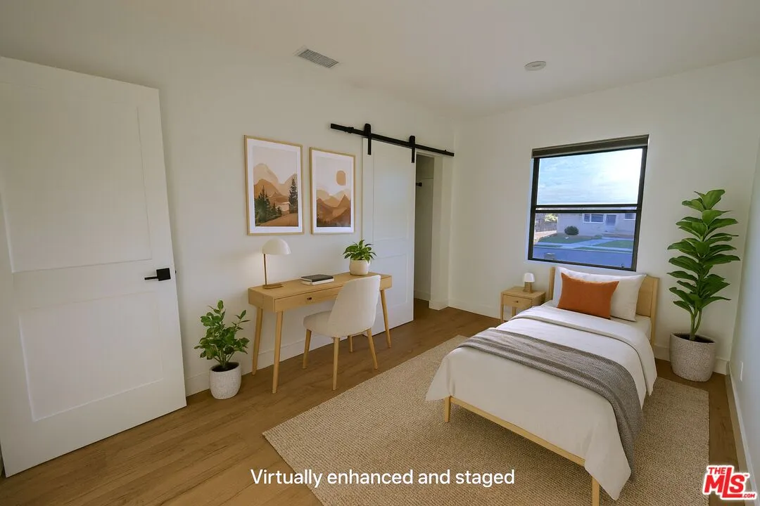 a workspace with furniture and a potted plant