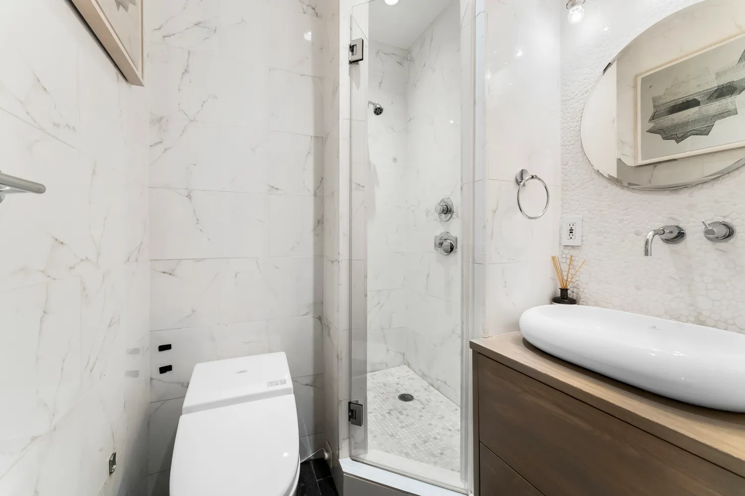 a bathroom with a toilet sink and shower