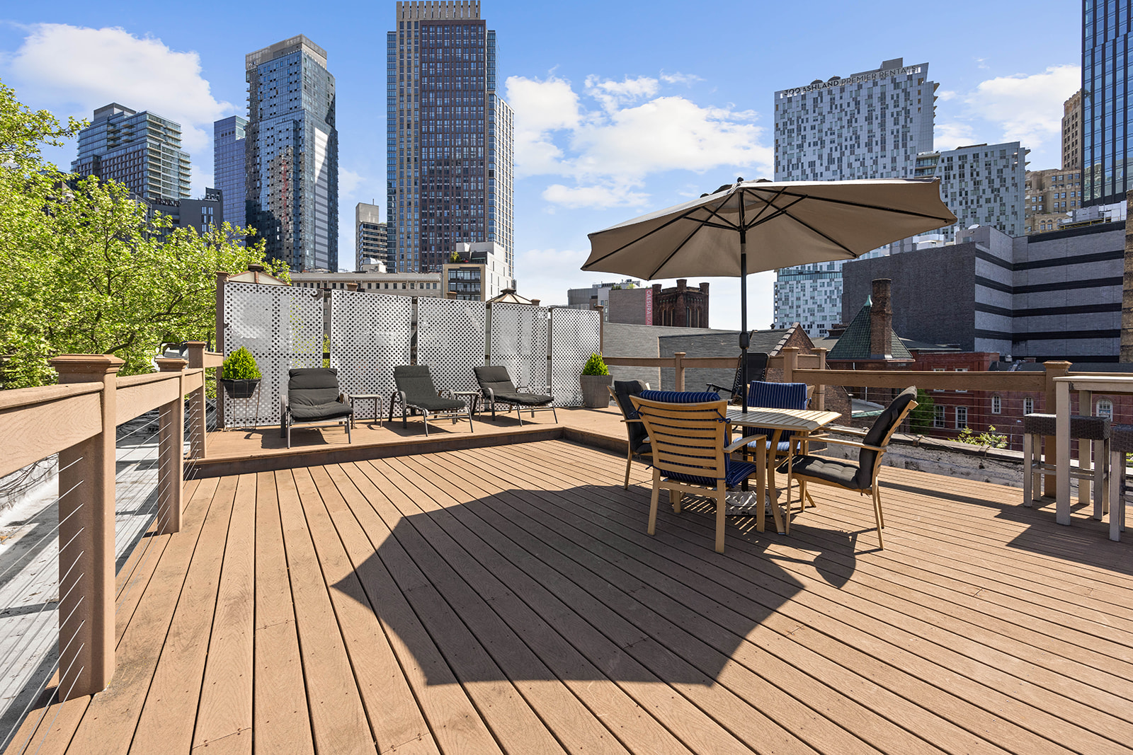 457 State Street, Unit 4BC Brooklyn, NY 11217 - Photo 10 of 13 a view of a rooftop deck with chairs and wooden floor