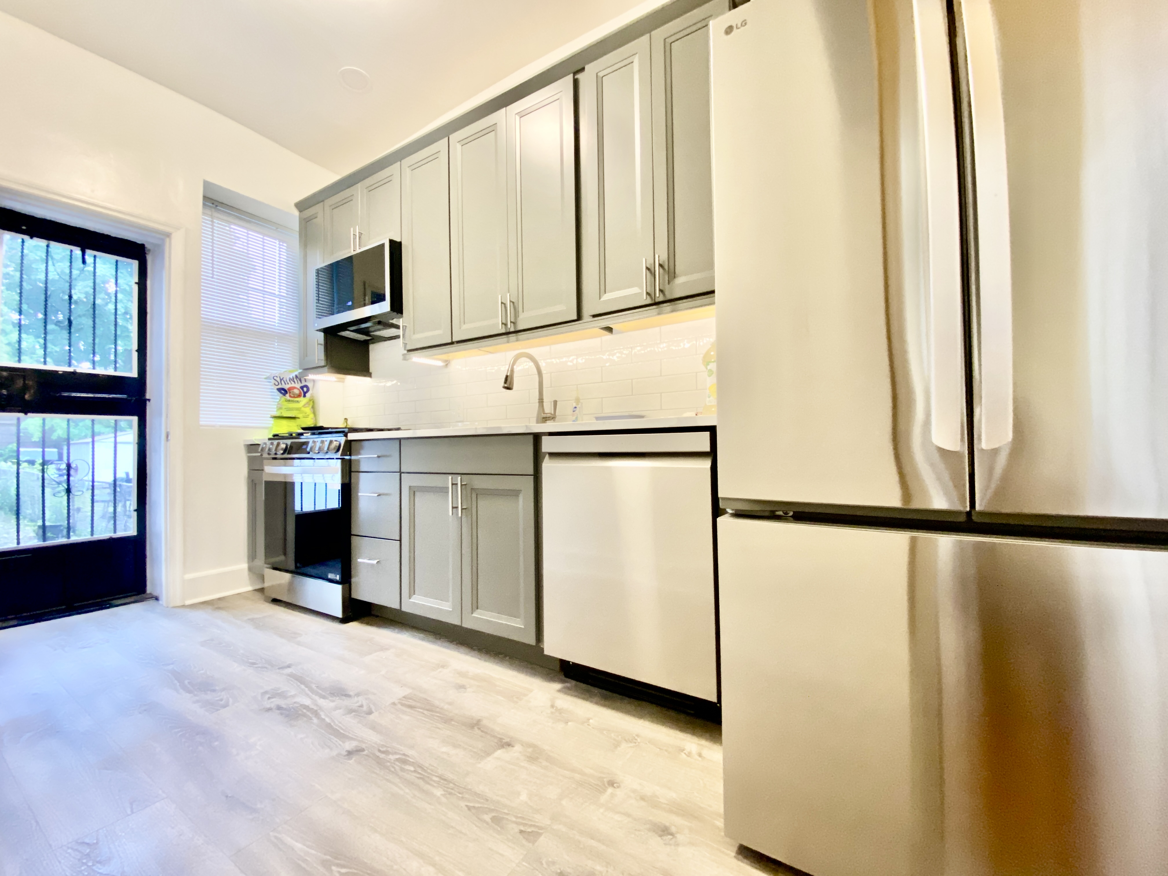 1308 Park Place, Unit 1 Brooklyn, NY 11213 - Photo 4 of 9 a view of a kitchen with electric appliances
