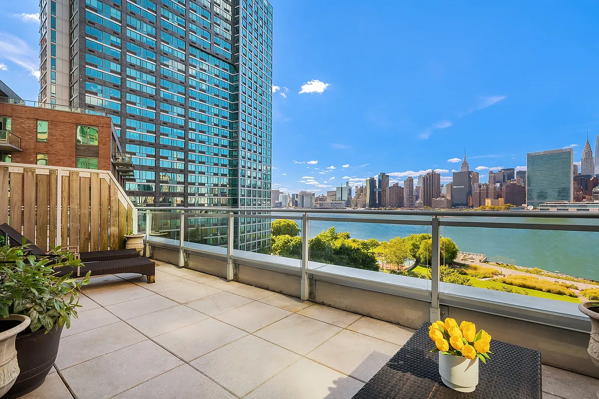 46-30 Center Boulevard, Unit 710 Queens, NY 11109 - Photo 6 of 25 a view of swimming pool with a lounge chairs