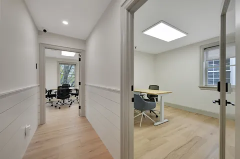 a view of a workspace with furniture