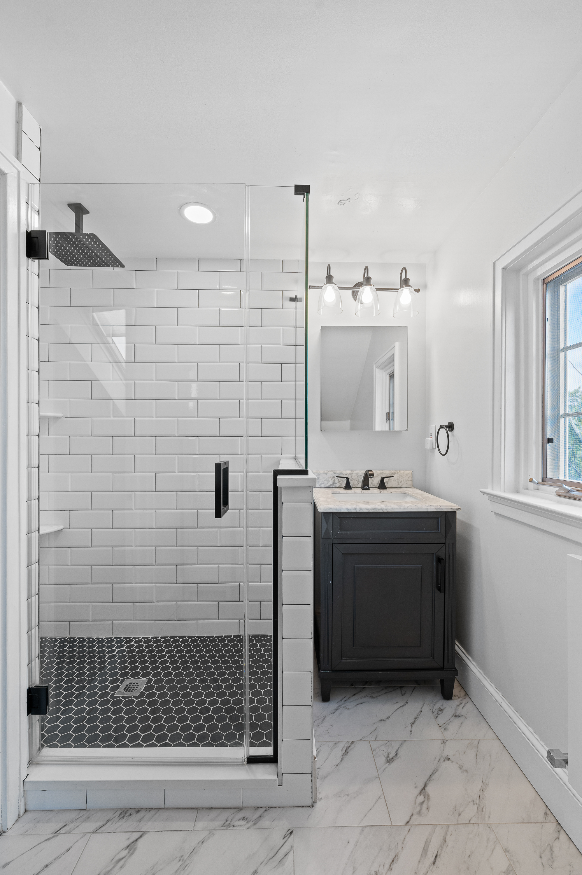 201 West Avenue Wayne, PA 19087 - Photo 13 of 26 a bathroom with a sink a mirror and shower