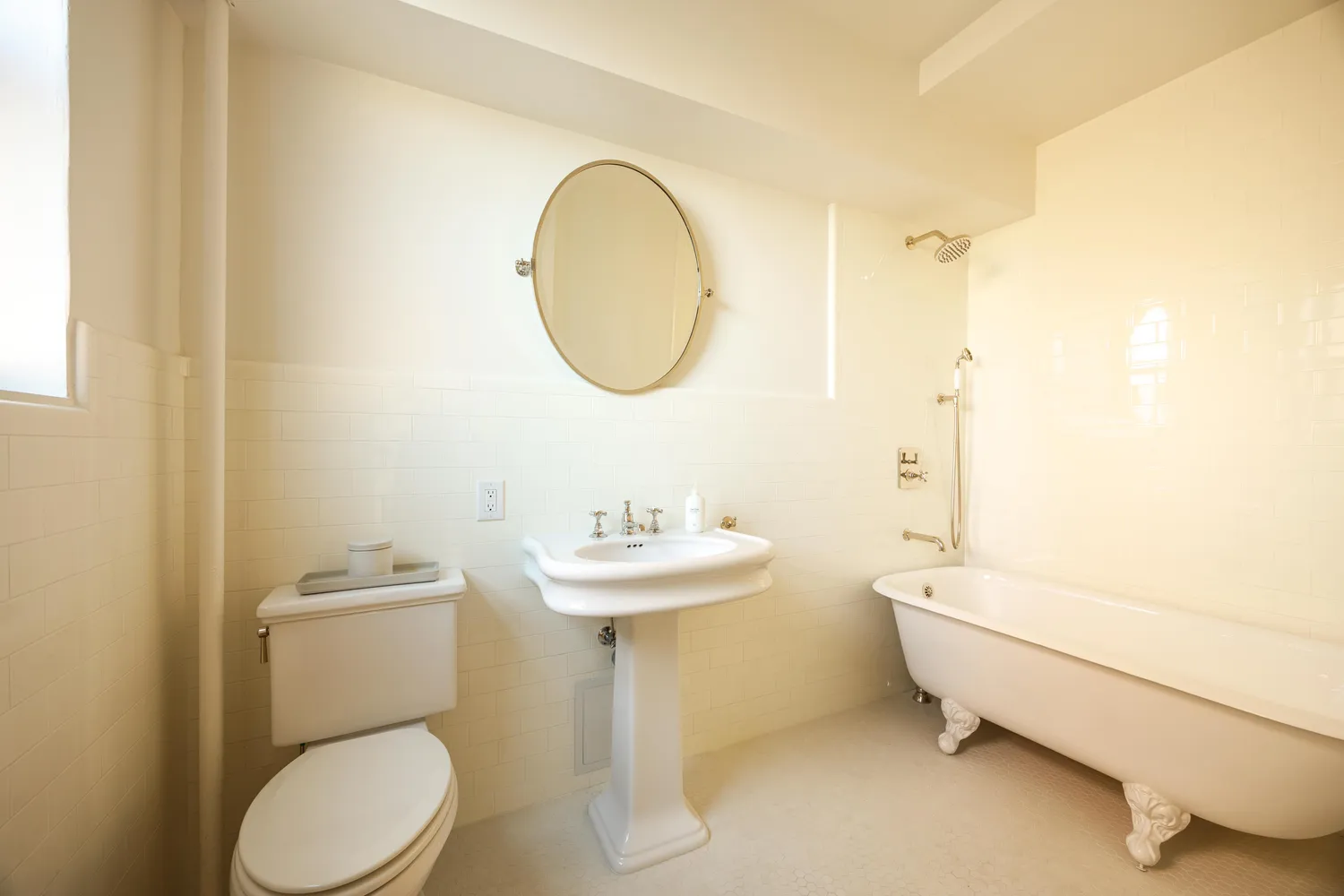 a bathroom with a sink toilet and a mirror