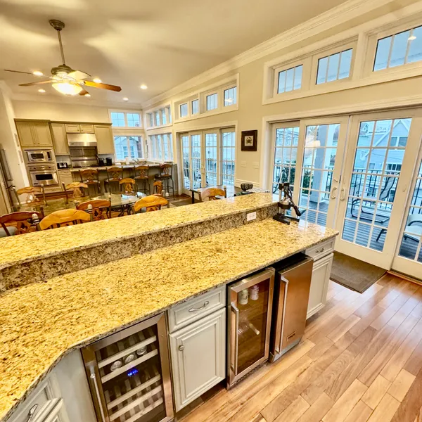 a view of a kitchen with granite countertop a sink and a counter top space