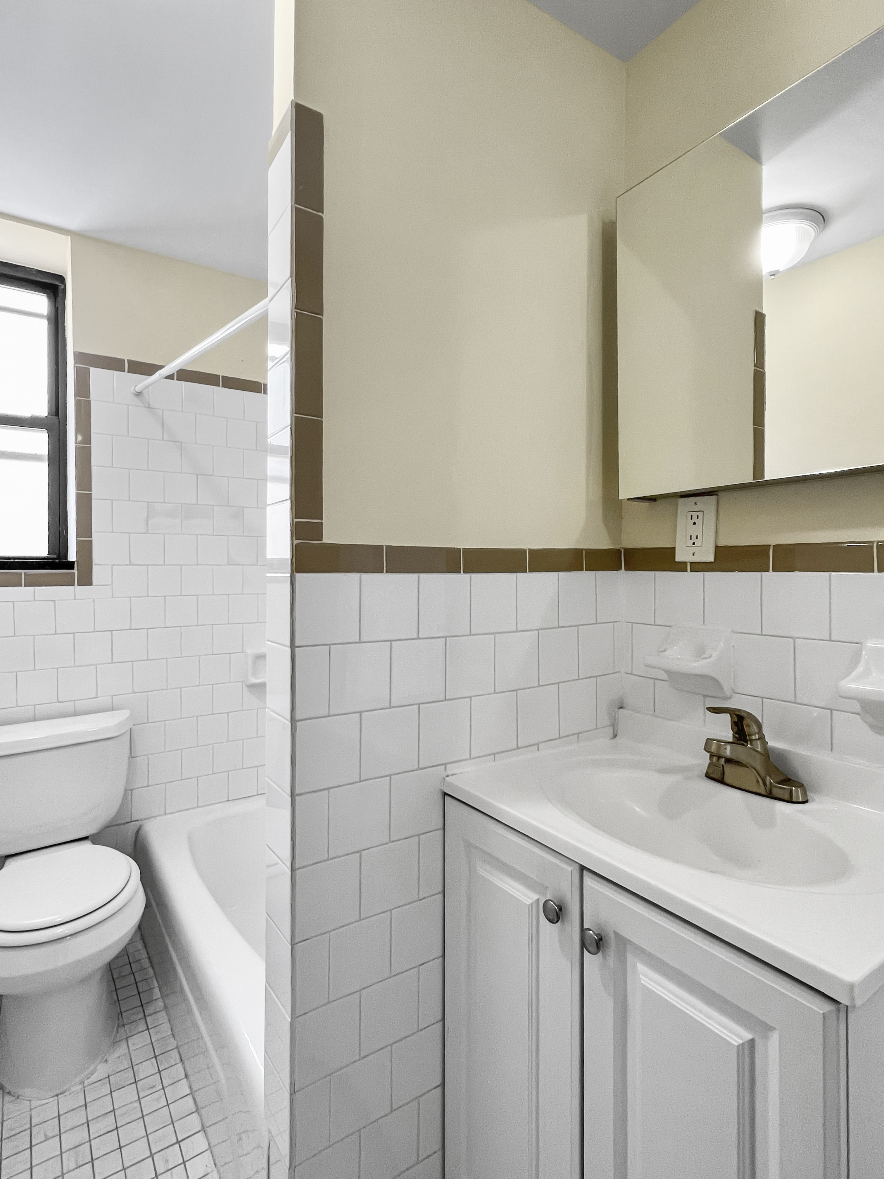 270 East 78th Street, Unit 13 Manhattan, NY 10075 - Photo 2 of 3 a bathroom with a sink a toilet and mirror