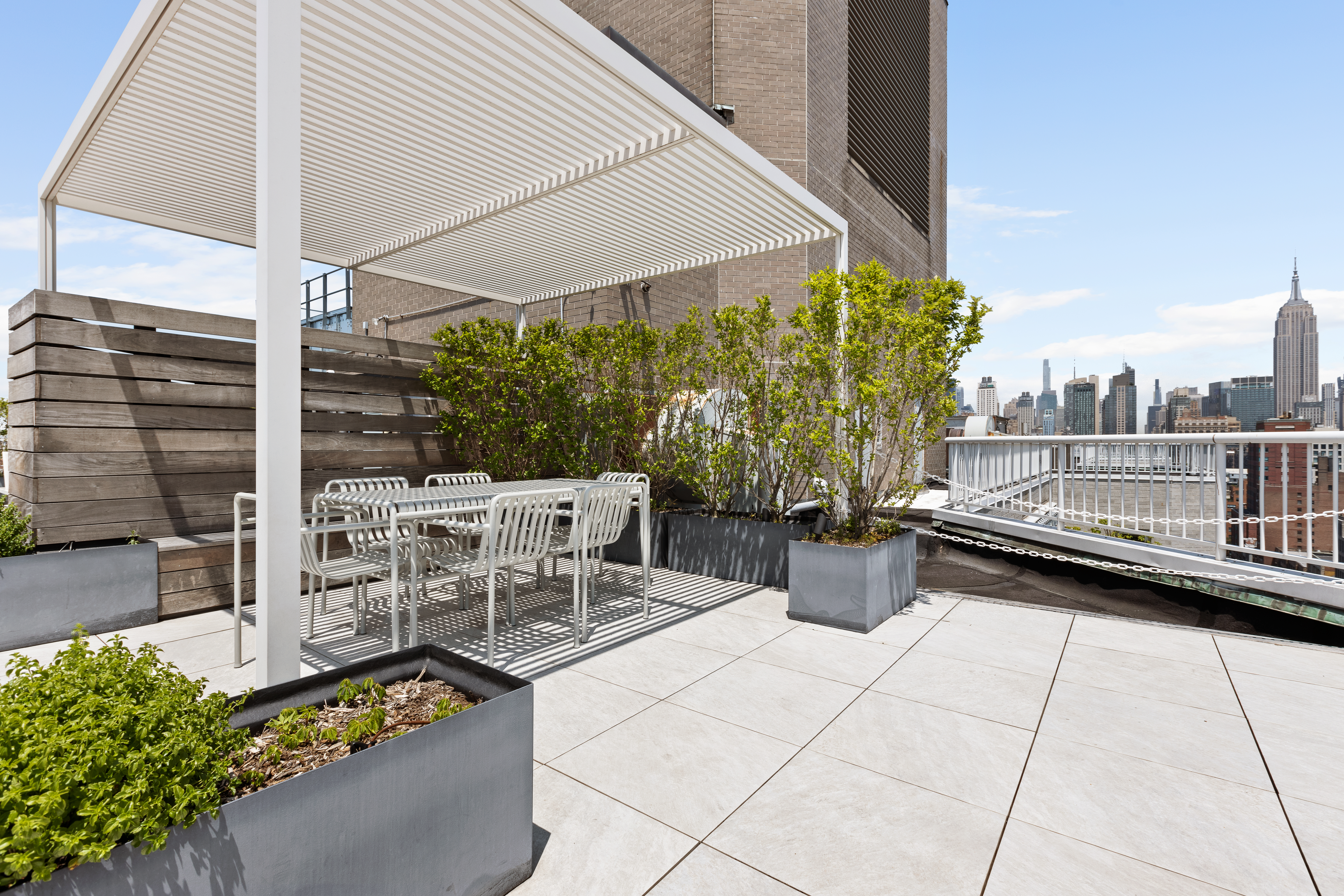101 West 12th Street, Unit 9D Manhattan, NY 10011 - Photo 6 of 8 a view of two chairs and table in the balcony