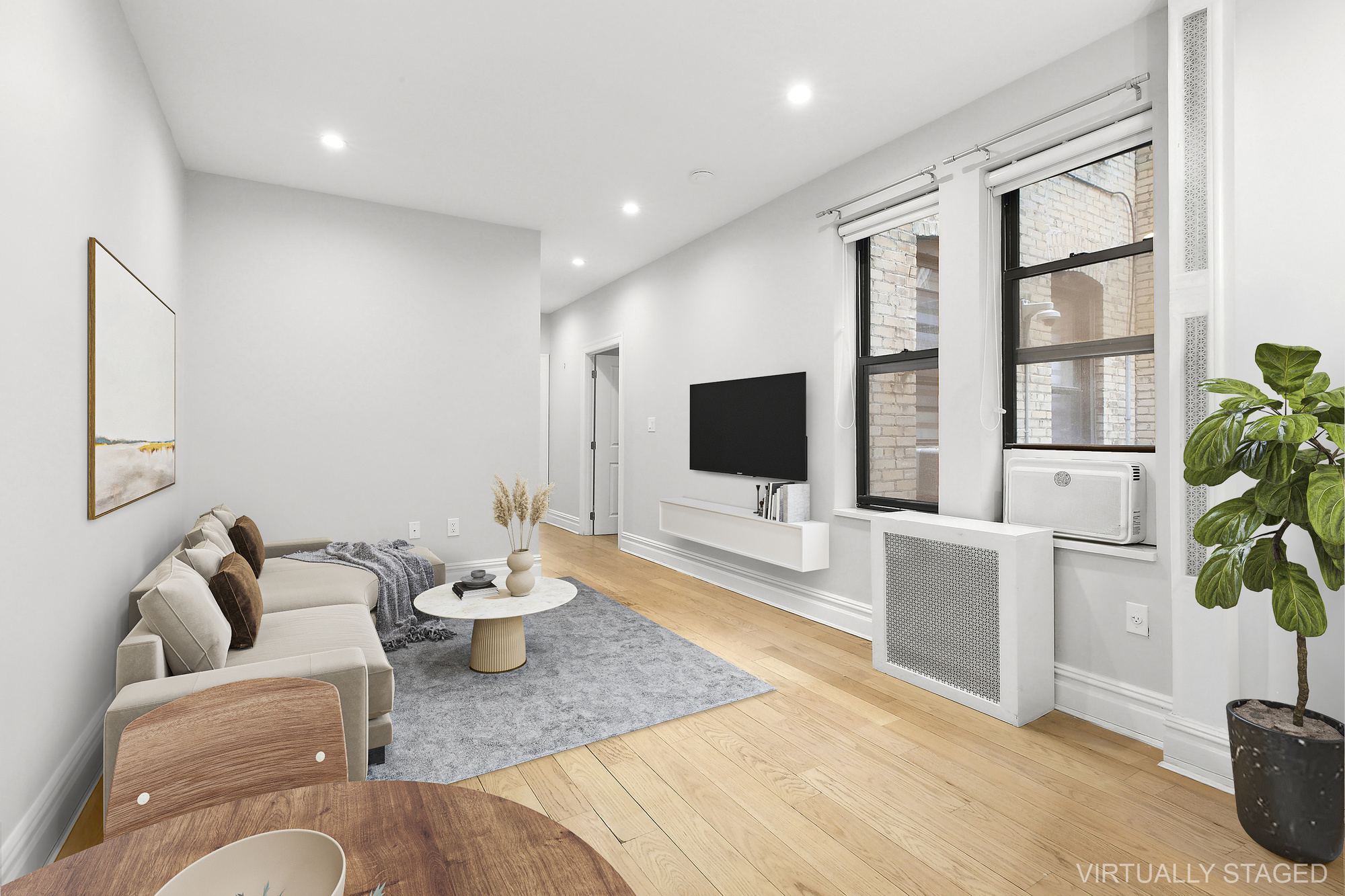 961 Washington Avenue, Unit 1I Brooklyn, NY 11225 - Photo 2 of 8 a living room with furniture a flat screen tv and a view of living room