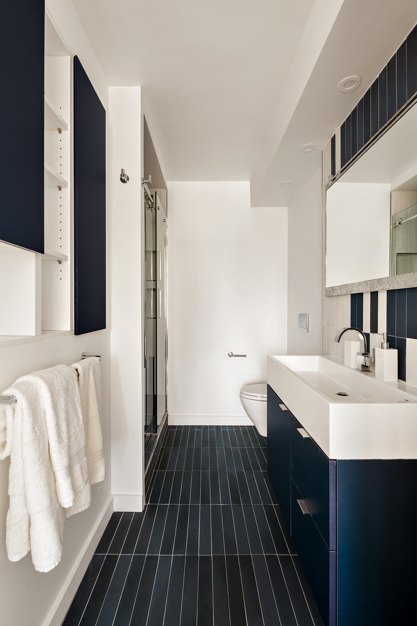 444 East 86th Street, Unit 15G Manhattan, NY 10028 - Photo 7 of 12 a bathroom with a sink and a mirror