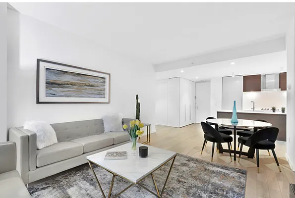 540 West 49th Street, Unit 206N Manhattan, NY 10019 - Photo 3 of 14 a living room with furniture and wooden floor