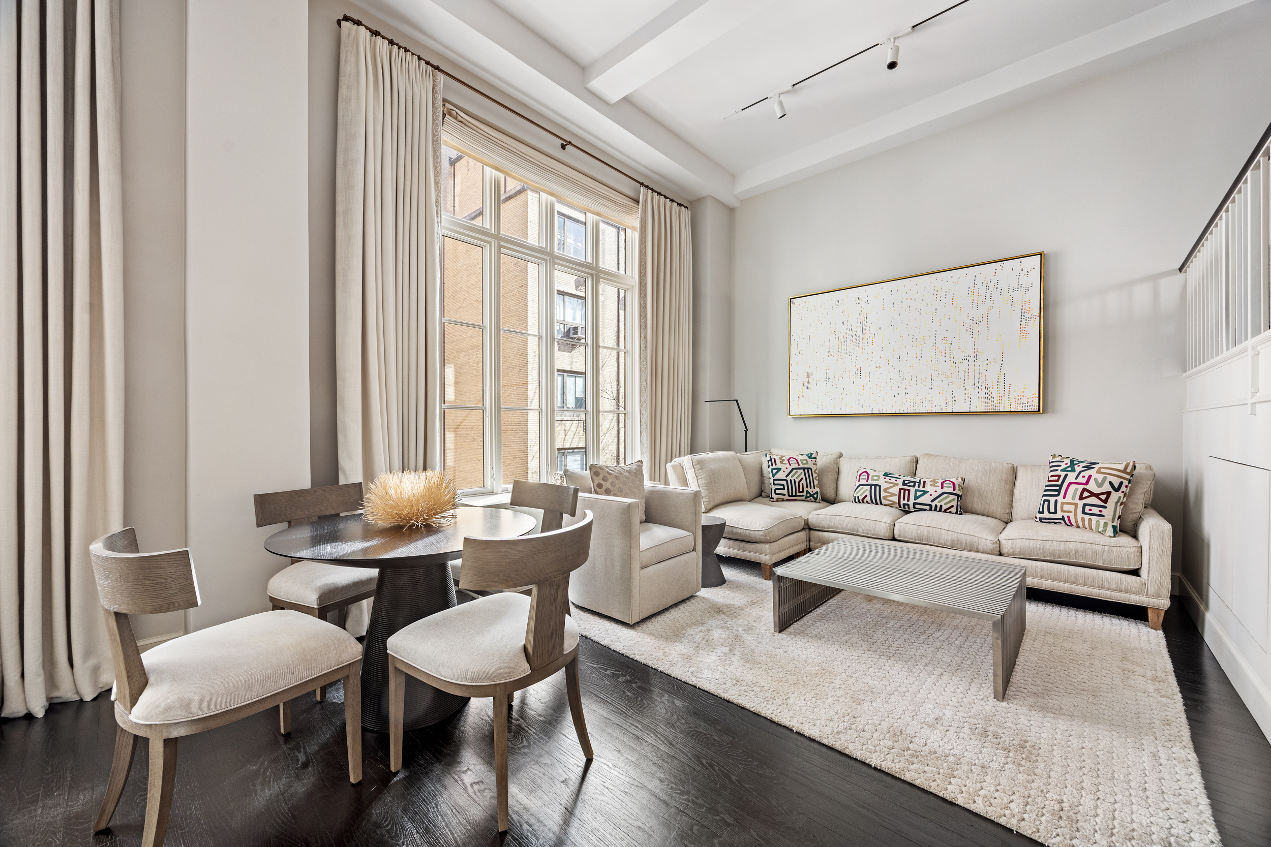 169 East 78th Street, Unit 7C Manhattan, NY 10075 - Photo 8 of 30 a living room with furniture and a large window
