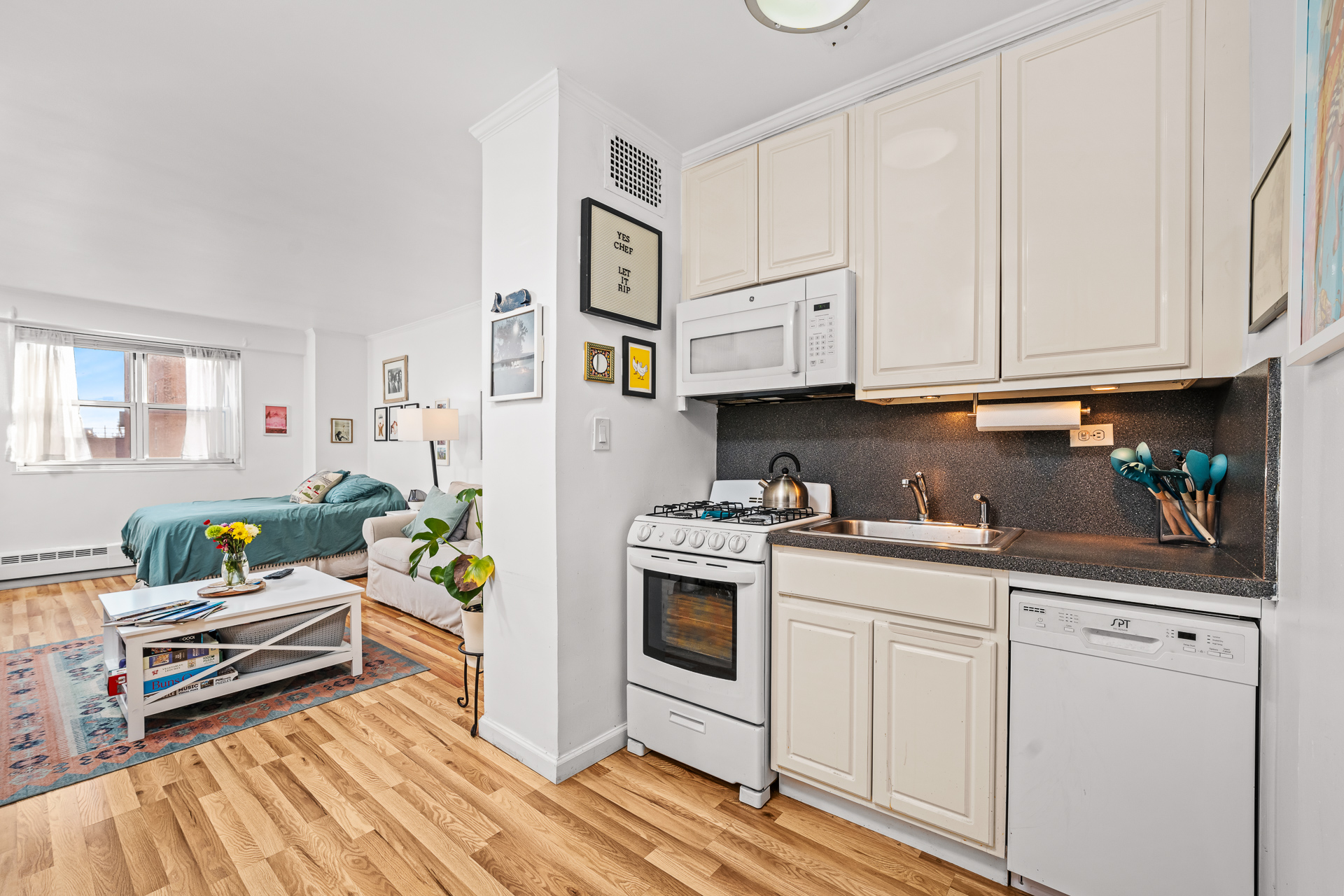 122 Ashland Place, Unit 14F Brooklyn, NY 11201 - Photo 3 of 16 a kitchen with stainless steel appliances granite countertop a stove a sink and a refrigerator