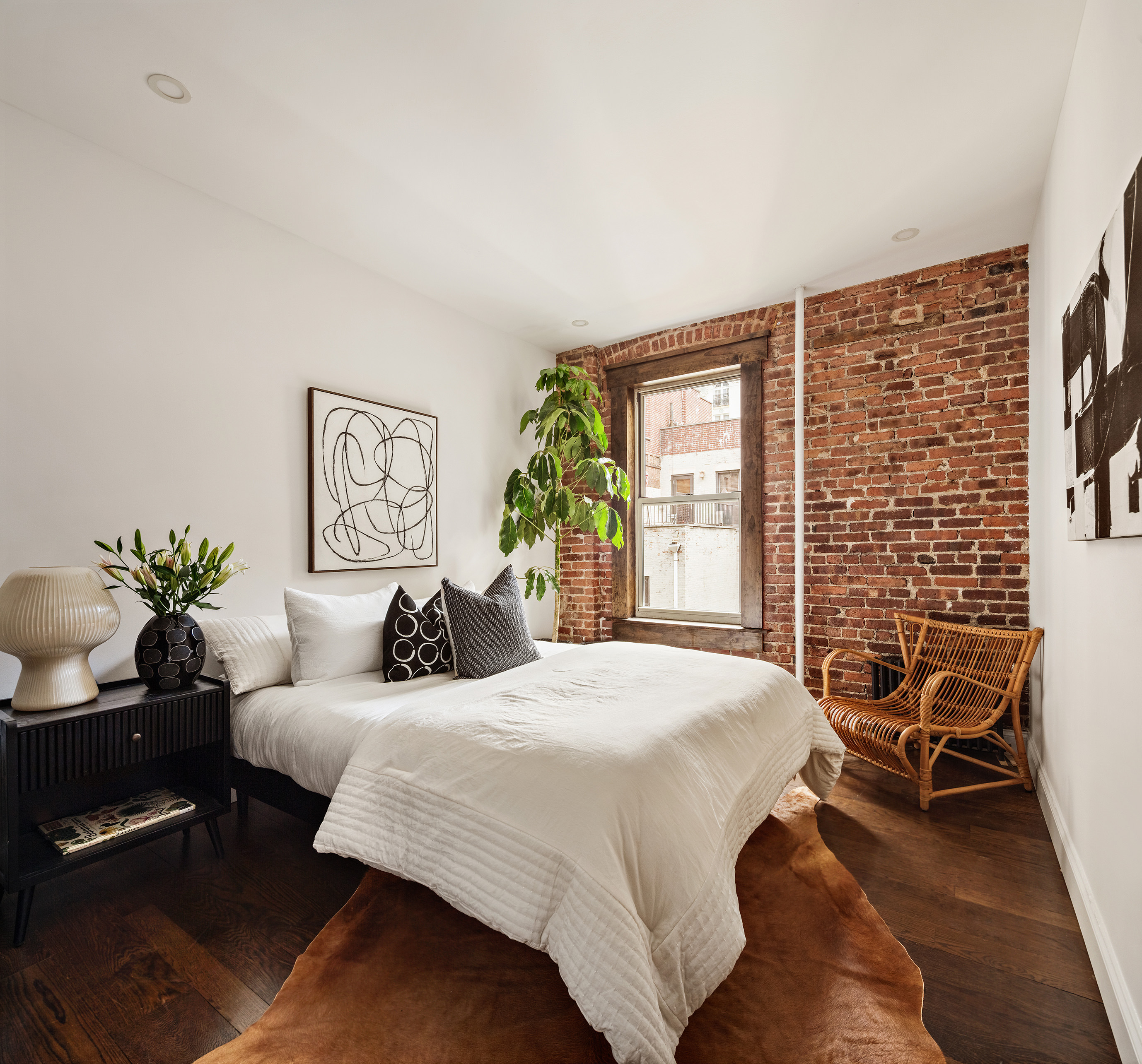 311 West 97th Street, Unit 5N Manhattan, NY 10025 - Photo 11 of 16 a bedroom with a bed and a chair