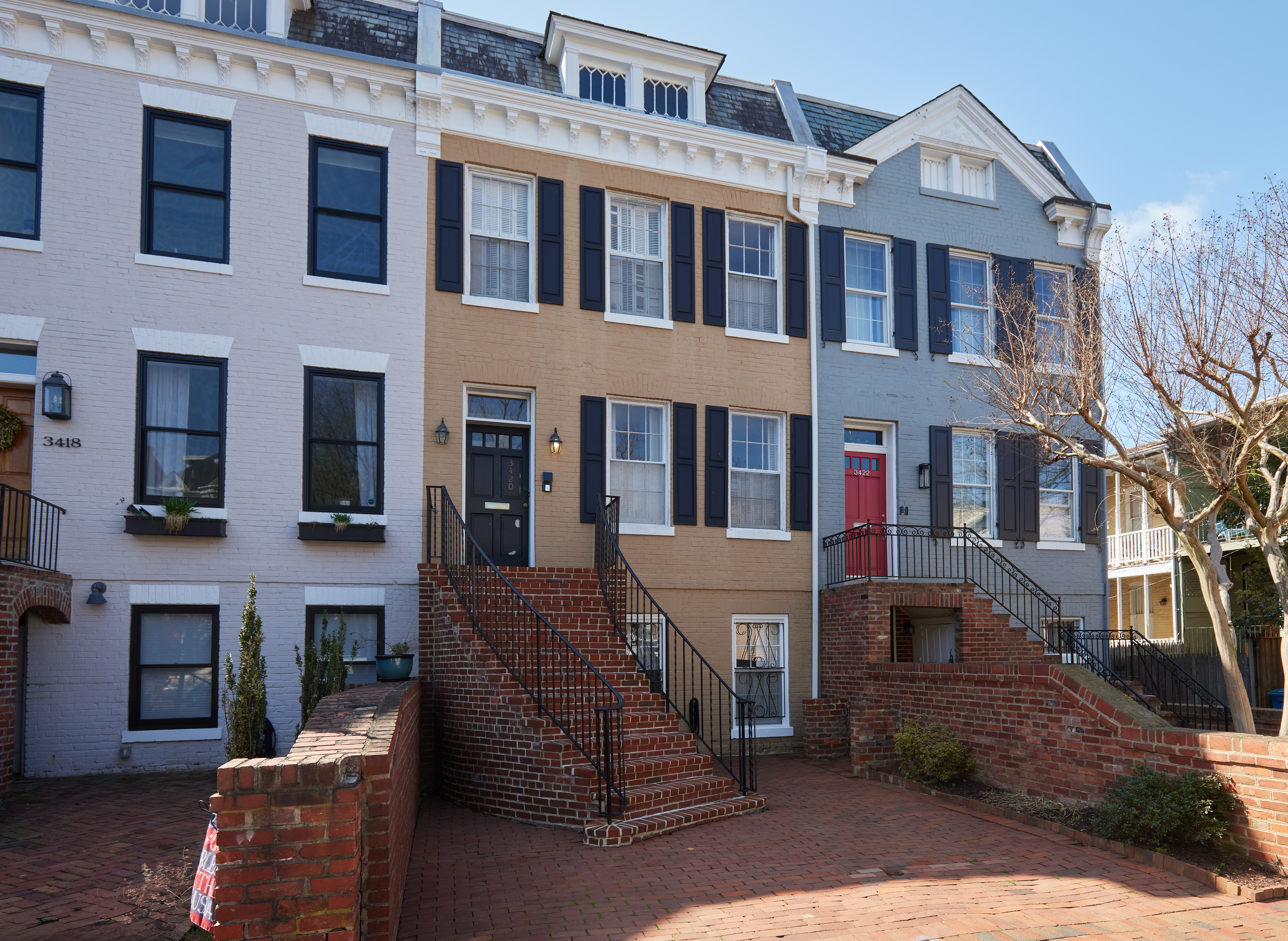 3420 R Street Northwest Washington, DC 20007 - Photo 4 of 53 a front view of a residential apartment building with a yard