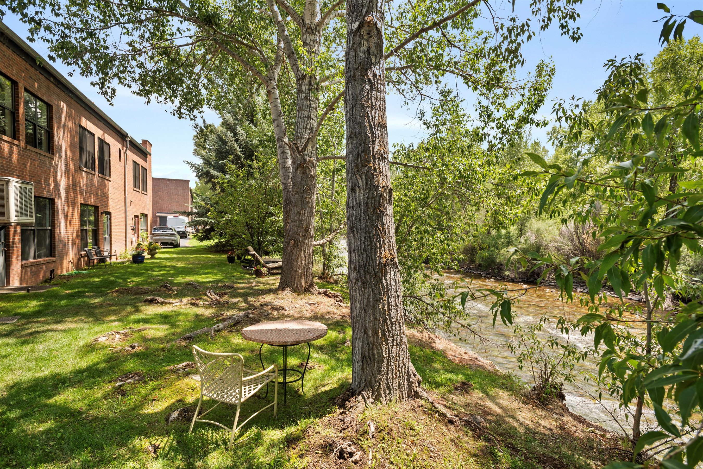 23286 Two Rivers Road, Unit 23 Basalt, CO 81621 - Photo 2 of 14 a view of a fountain in the yard of a house