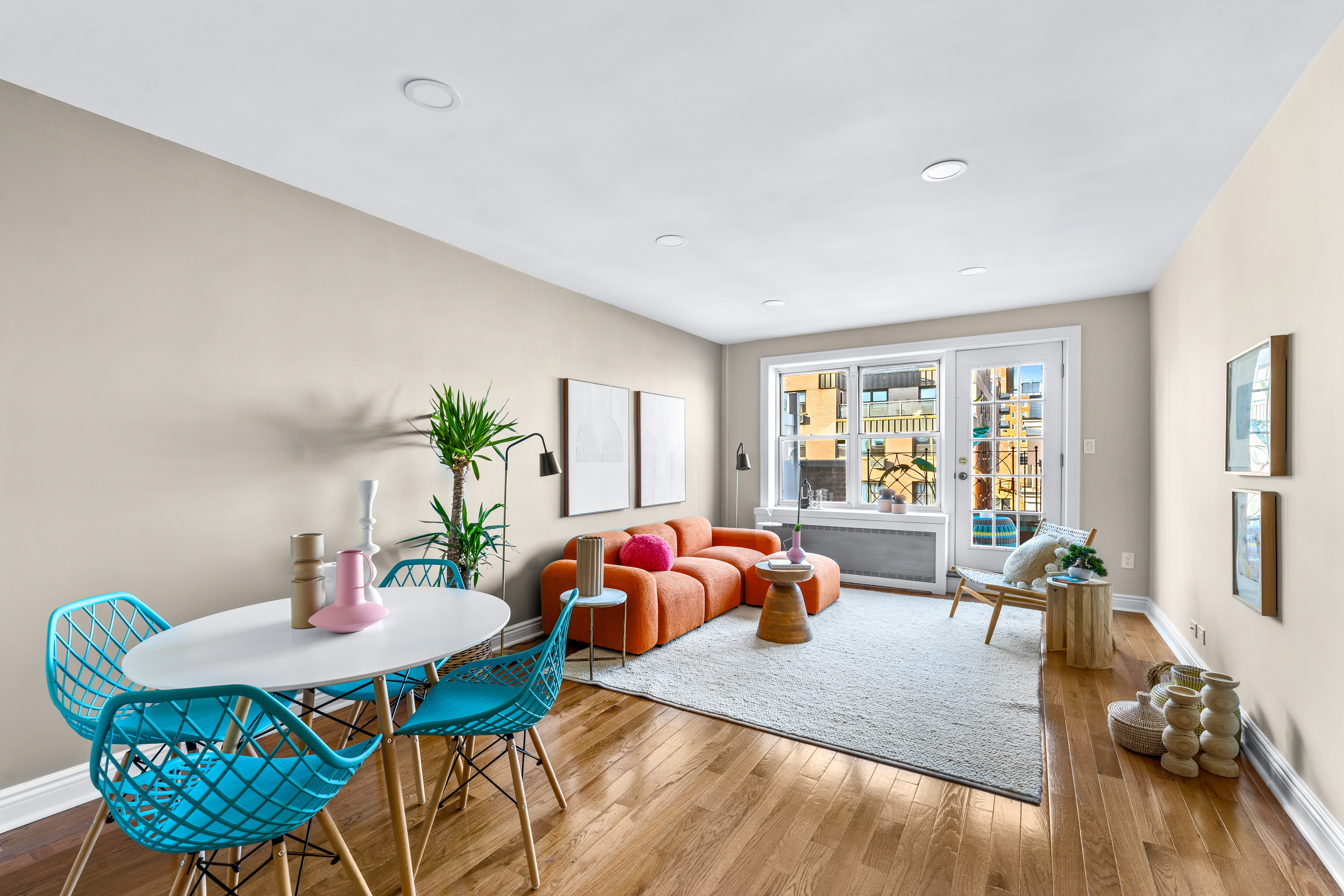 71-36 110th Street, Unit PH7E Queens, NY 11375 - Photo 1 of 16 a living room with furniture and wooden floor