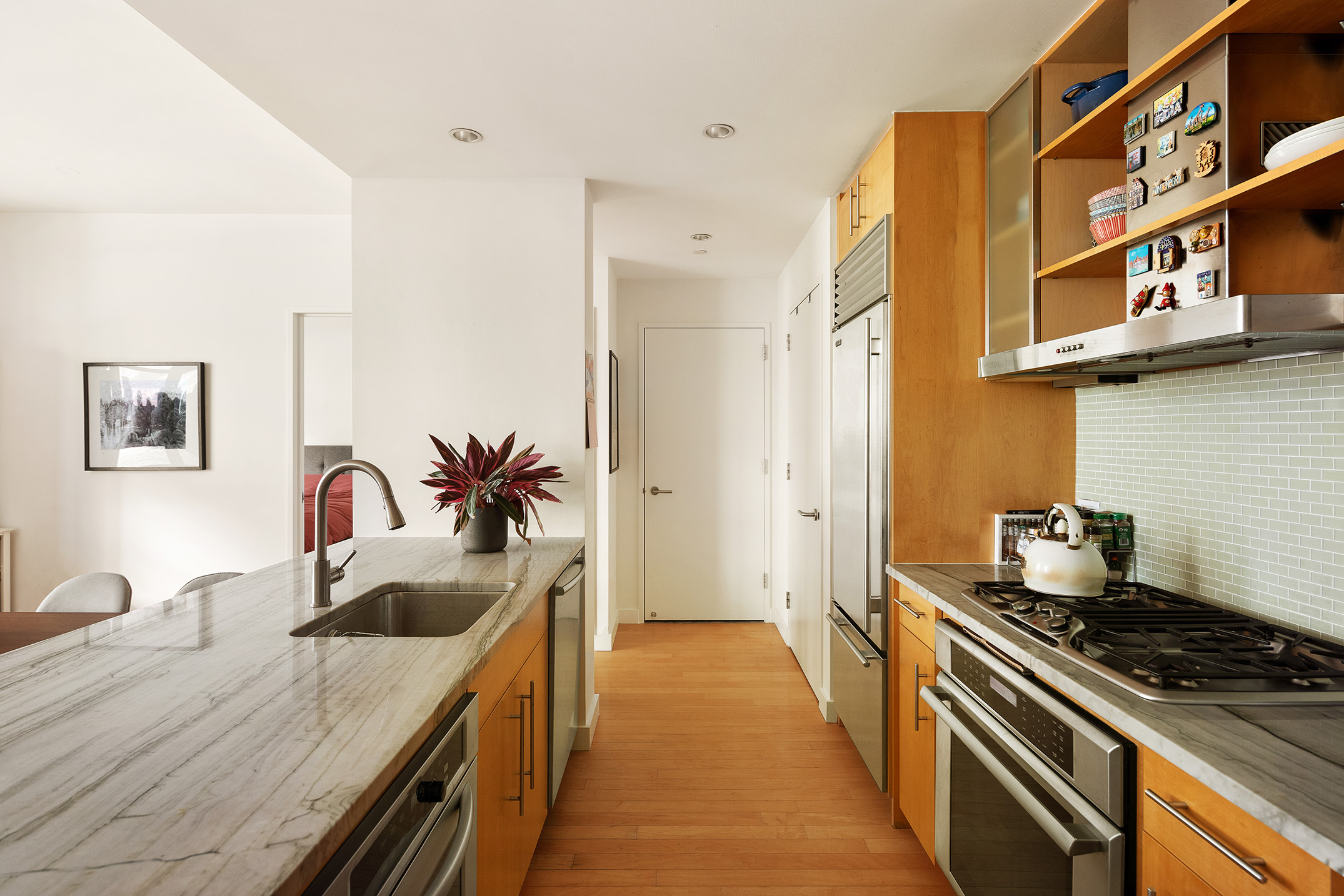 1 Northside Piers, Unit 18C Brooklyn, NY 11249 - Photo 3 of 12 a kitchen with stainless steel appliances granite countertop a stove a sink and a refrigerator
