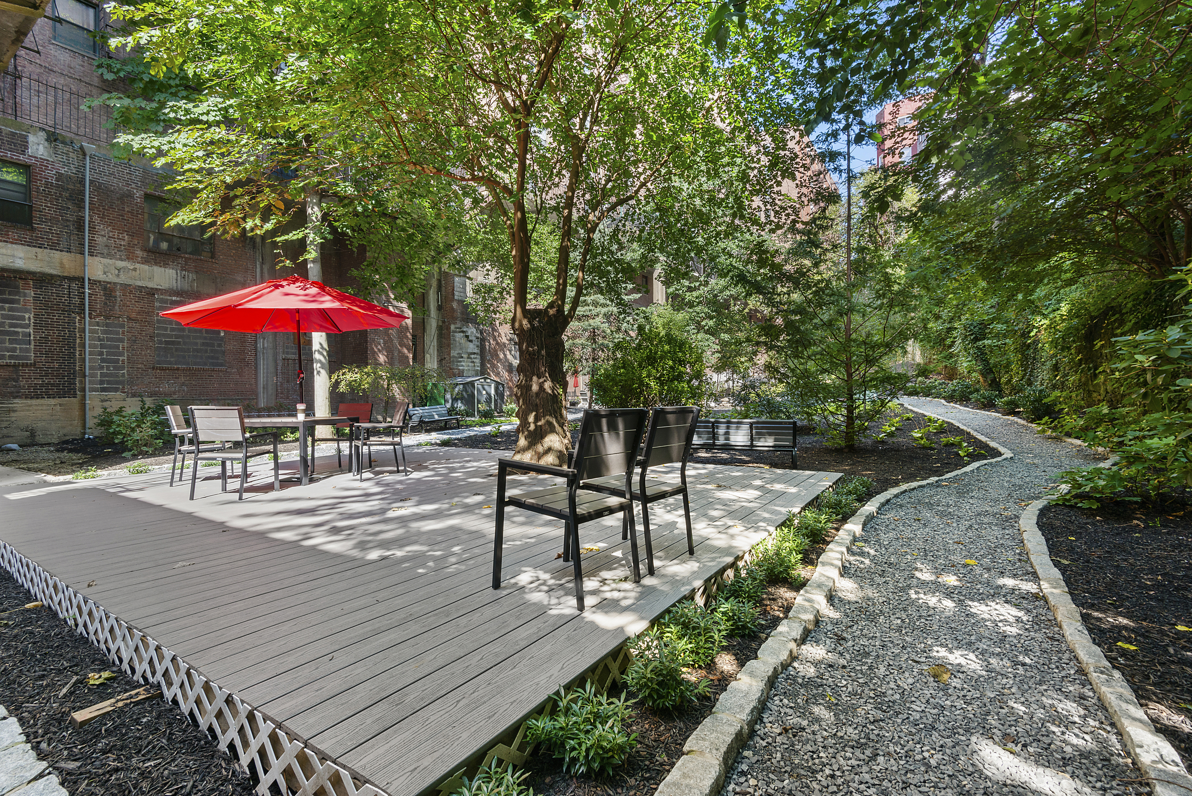 159-34 Riverside Drive West, Unit 7L90 Manhattan, NY 10032 - Photo 18 of 22 a view of a dinning table with chairs in patio