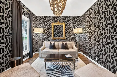 a living room with a couch and a potted plant