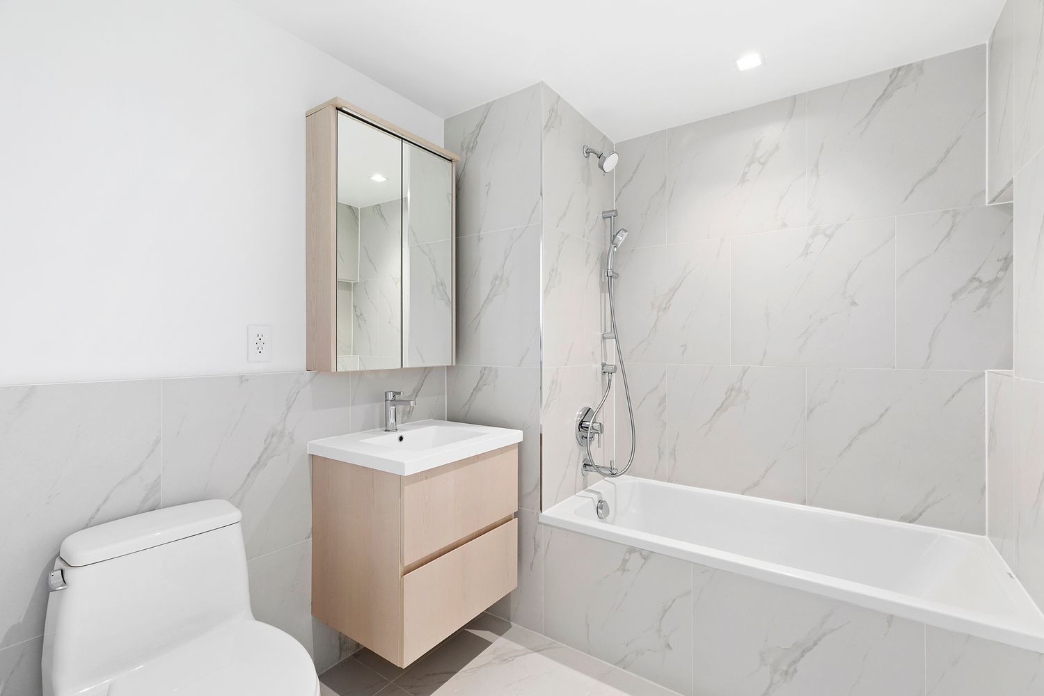 567 Ocean Avenue, Unit B504 Brooklyn, NY 11226 - Photo 7 of 8 a bathroom with a sink toilet and shower