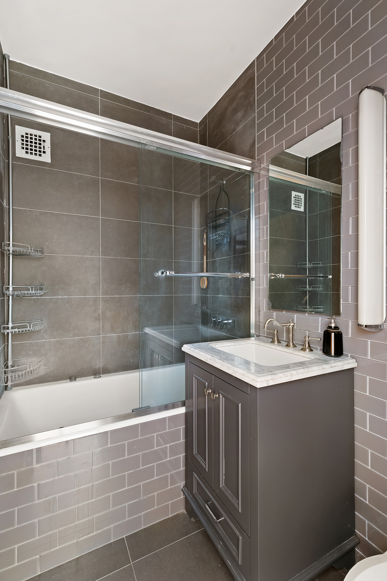 3 Hanover Square, Unit 14EF Manhattan, NY 10004 - Photo 8 of 14 a bathroom with a bathtub and a sink