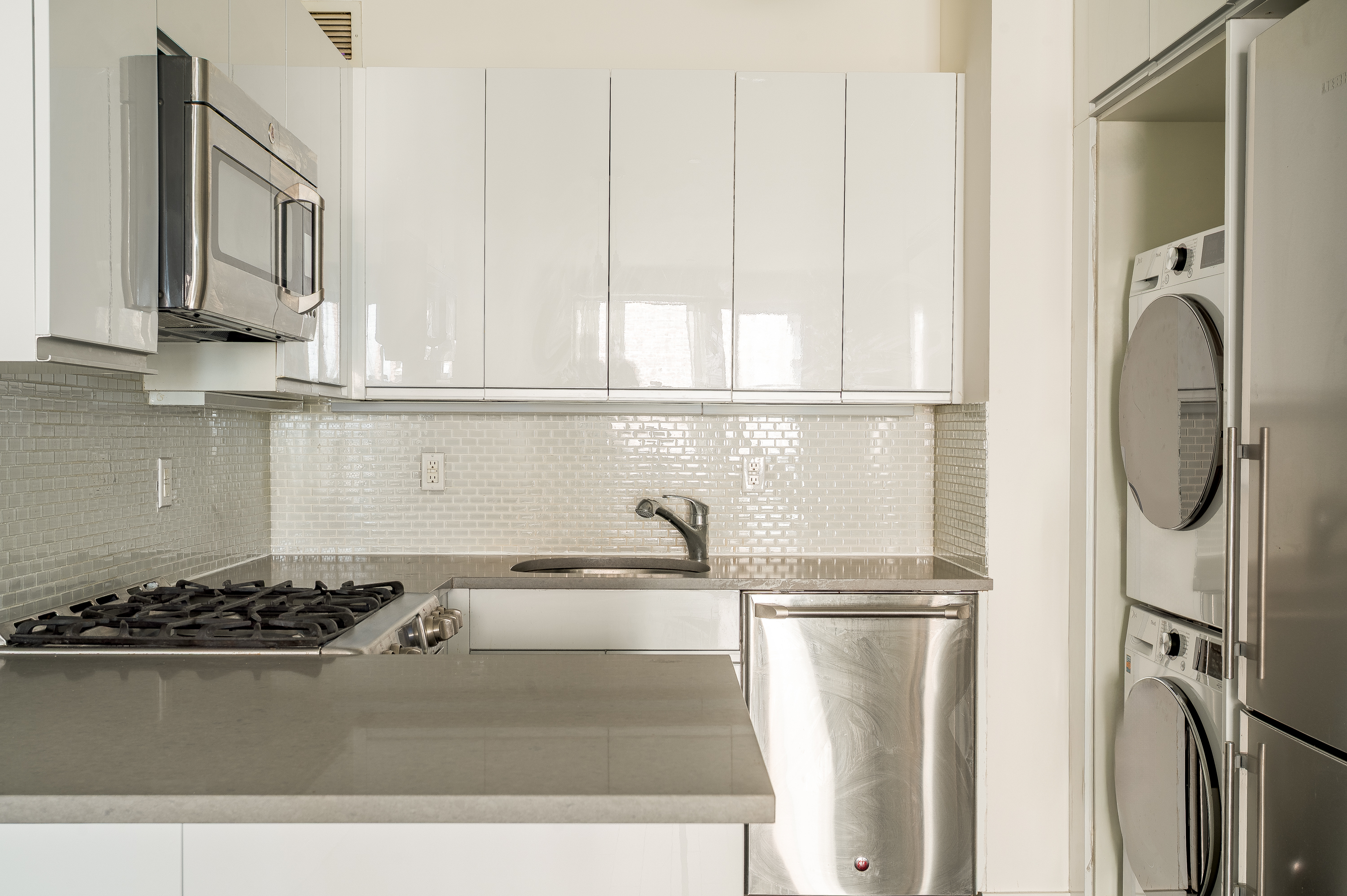 753 St Nicholas Avenue, Unit 2B Manhattan, NY 10031 - Photo 5 of 10 a kitchen with a refrigerator and a sink