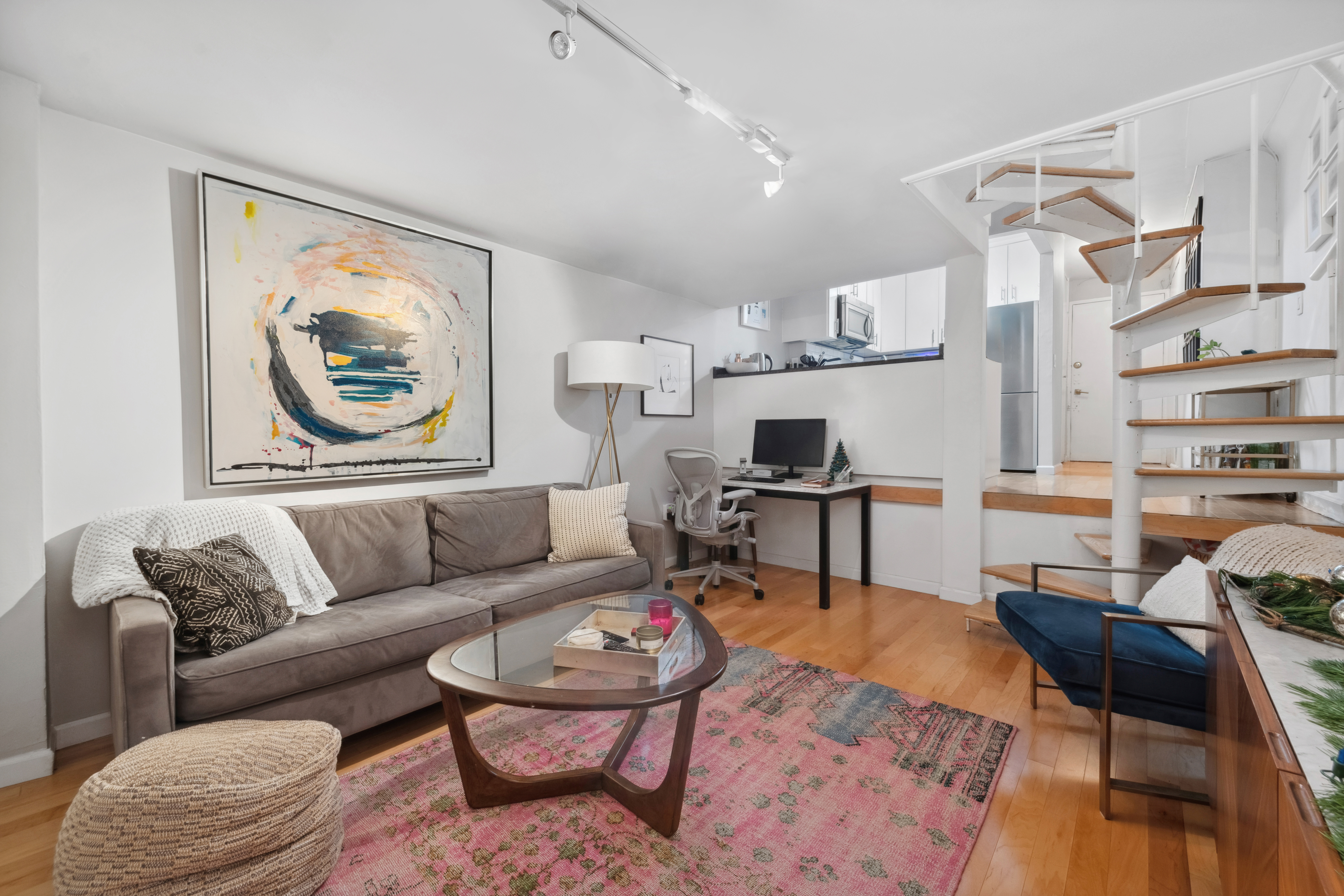 211 Thompson Street, Unit GLD Manhattan, NY 10012 - Photo 4 of 10 a living room with furniture and a rug