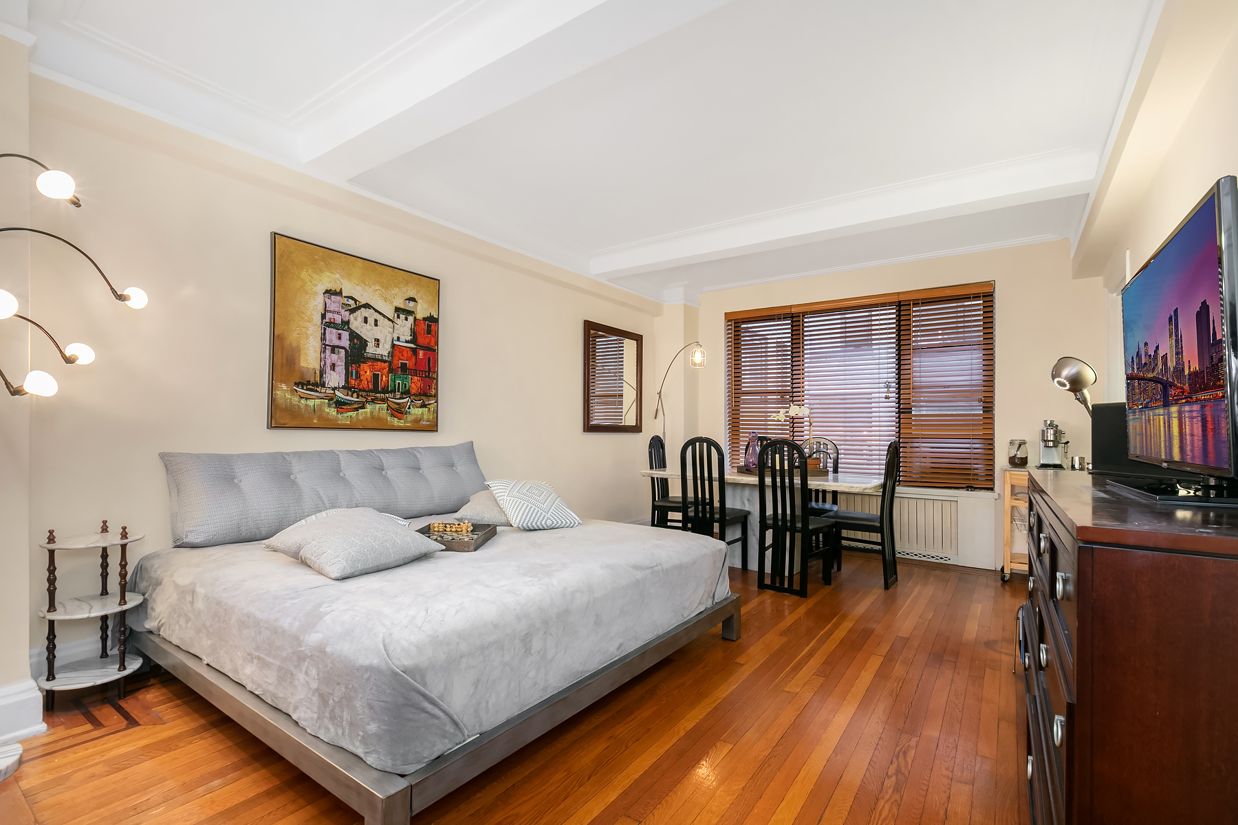 7 Park Avenue, Unit 7J Manhattan, NY 10016 - Photo 2 of 8 a bedroom with a bed and a table in it