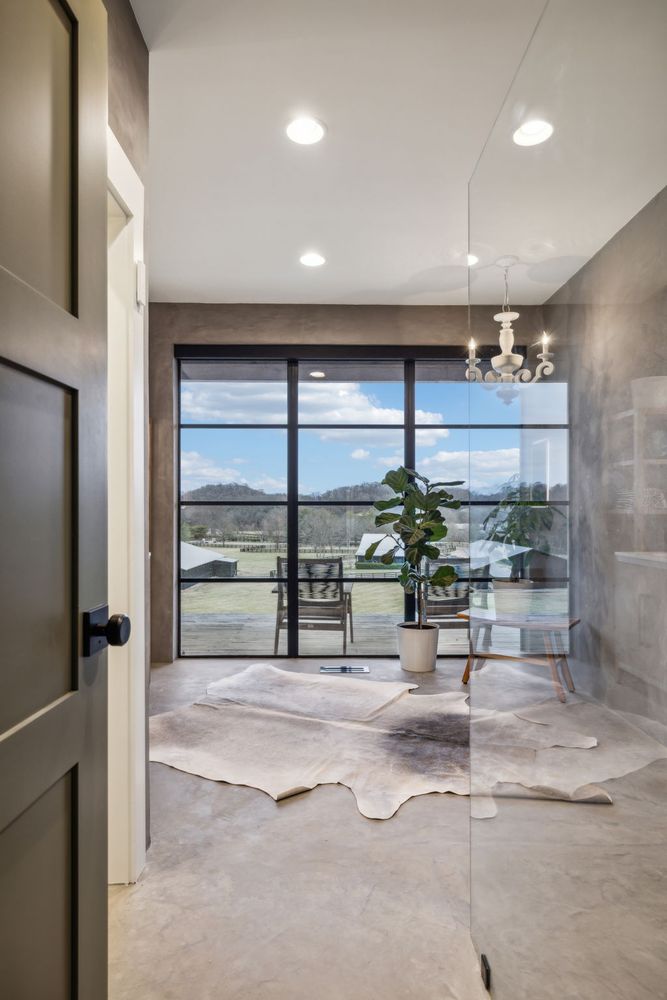 a lobby with furniture and a large window