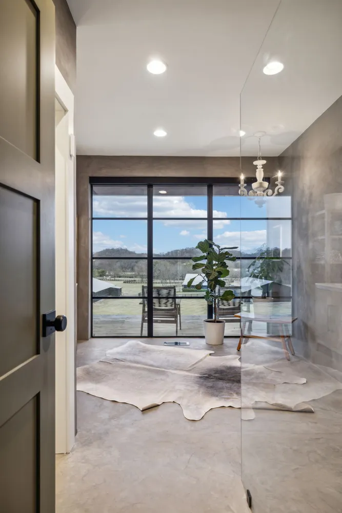 a lobby with furniture and a large window