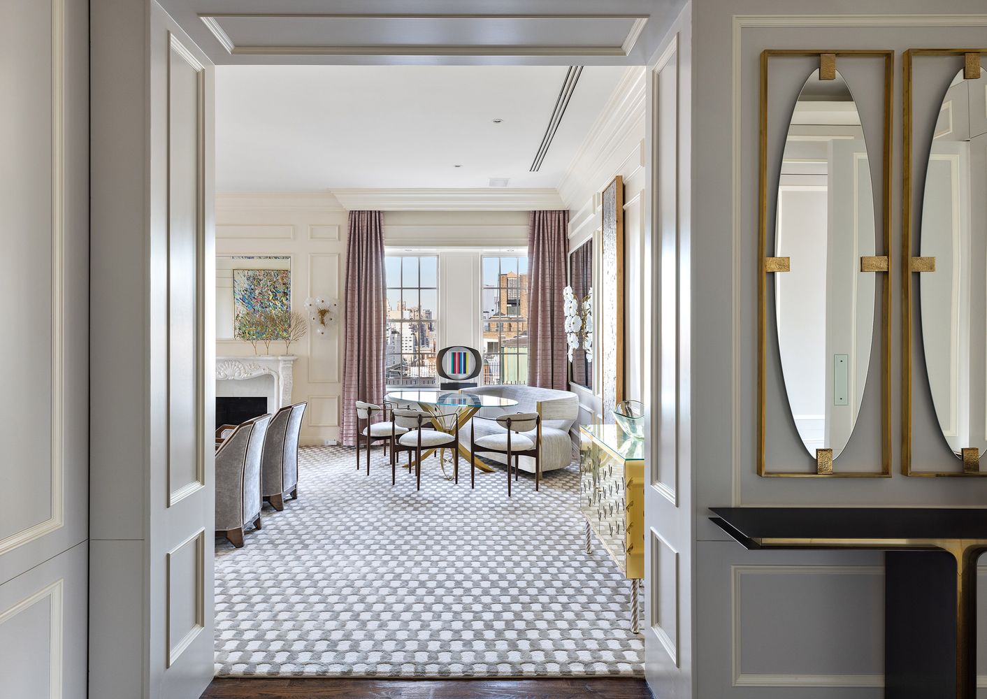 a living room with furniture a fireplace and a table