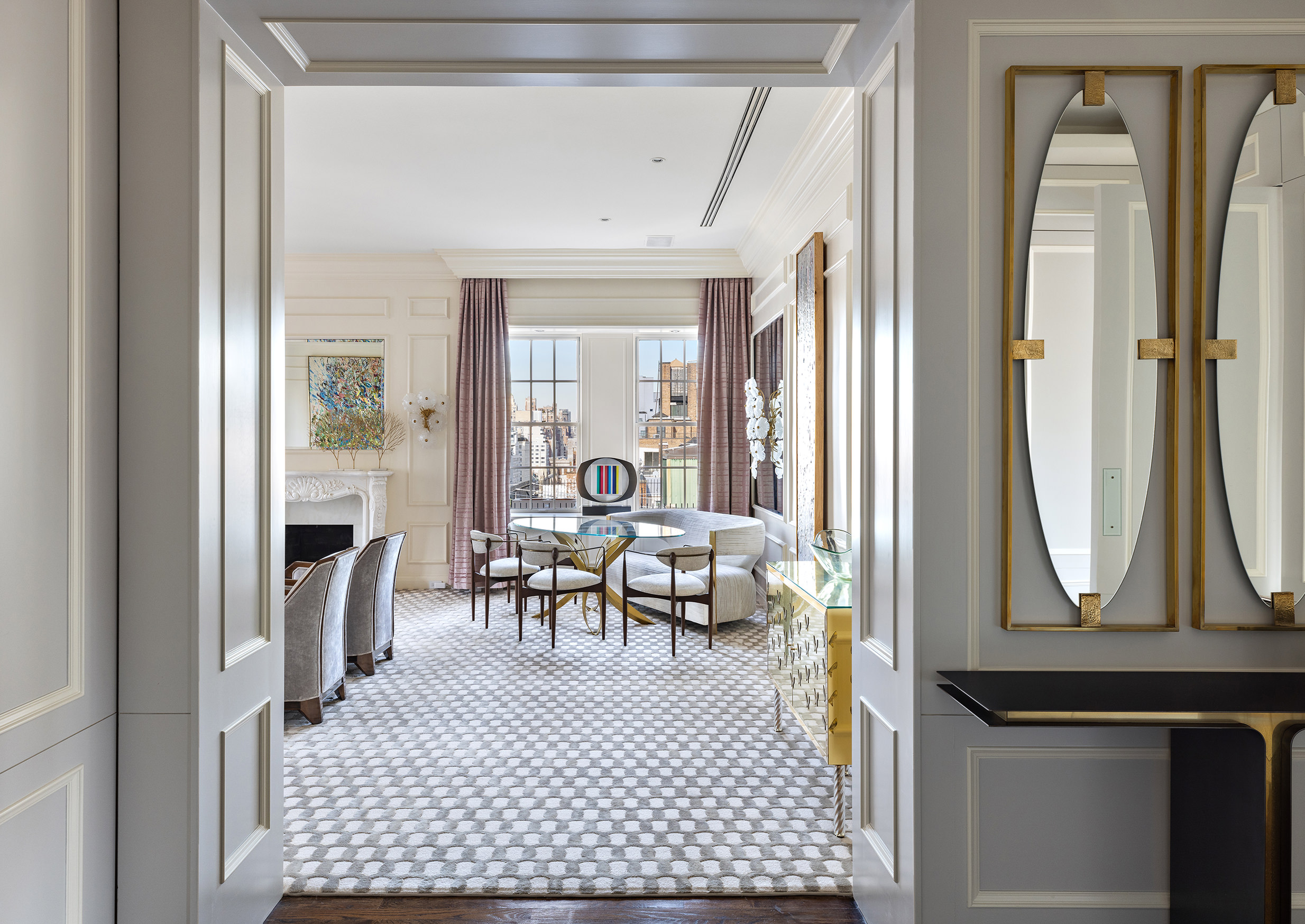 535 Park Avenue, Unit 14C Manhattan, NY 10065 - Photo 7 of 18 a living room with furniture a fireplace and a table