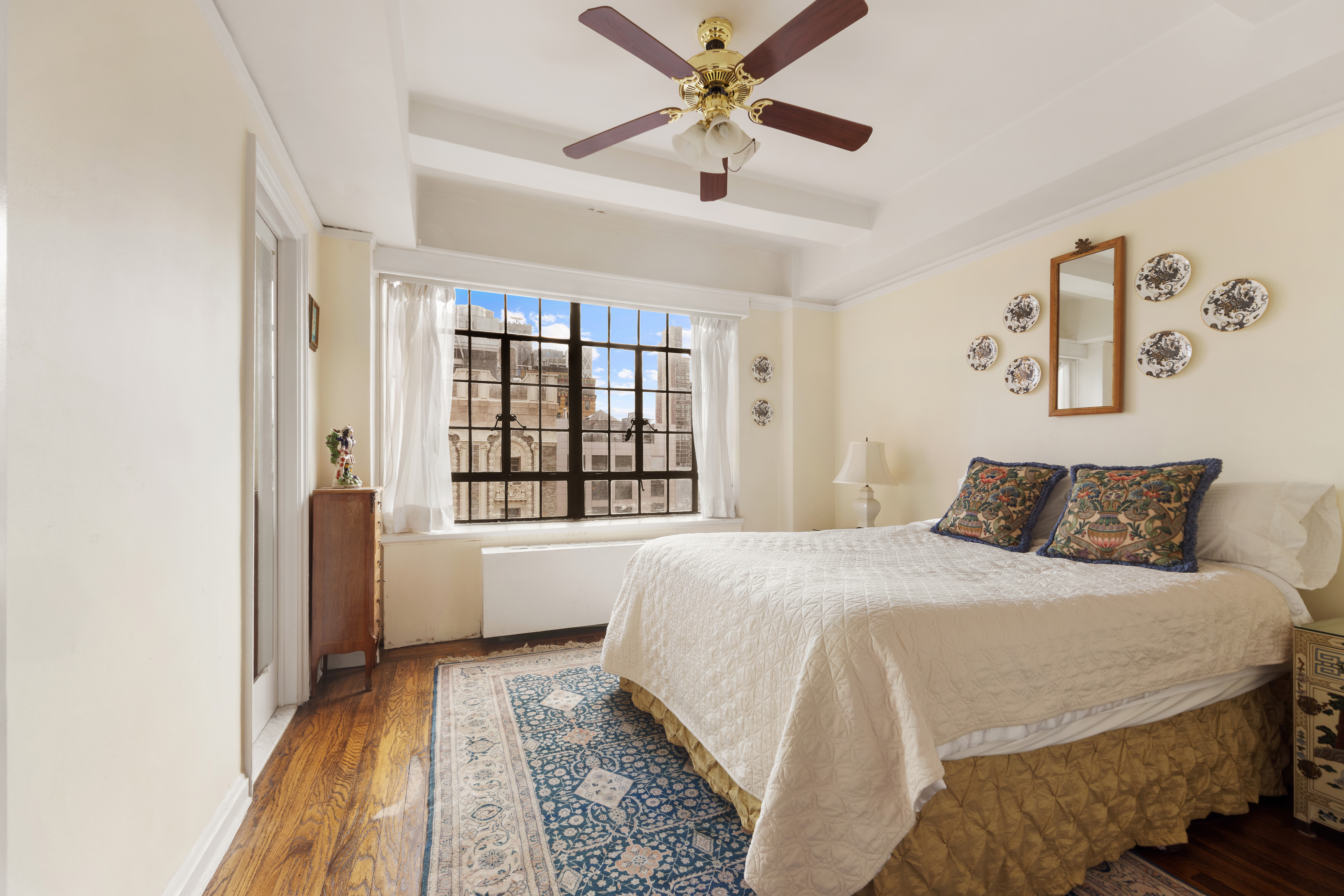 10 Park Avenue, Unit 26A Manhattan, NY 10016 - Photo 3 of 10 a bedroom with a large bed and a window