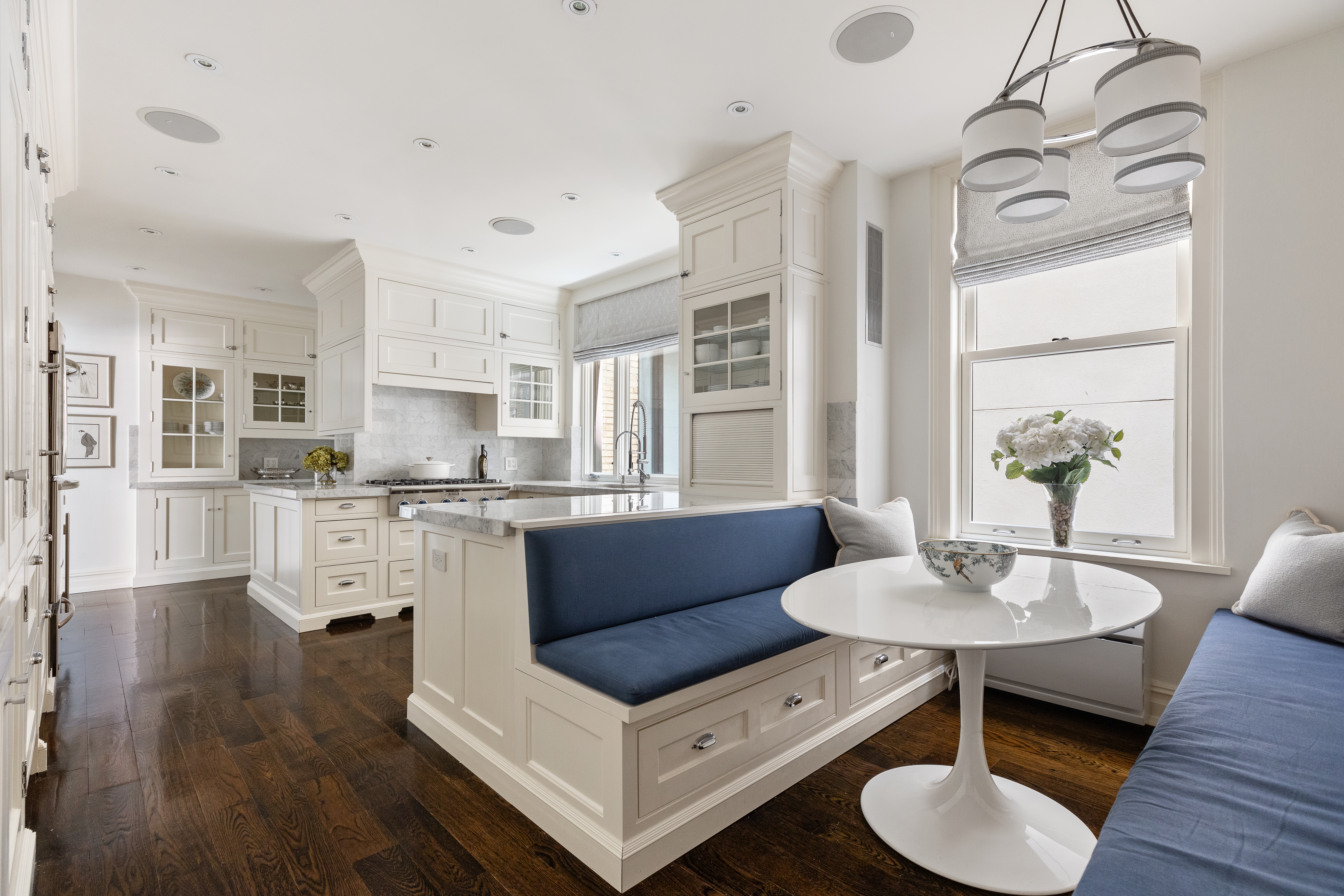 1112 Park Avenue, Unit 6A Manhattan, NY 10128 - Photo 13 of 15 a living room with stainless steel appliances furniture and a kitchen view