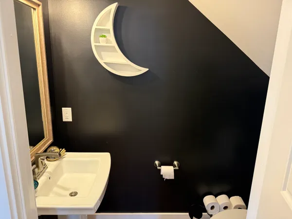 a bathroom with a sink and mirror