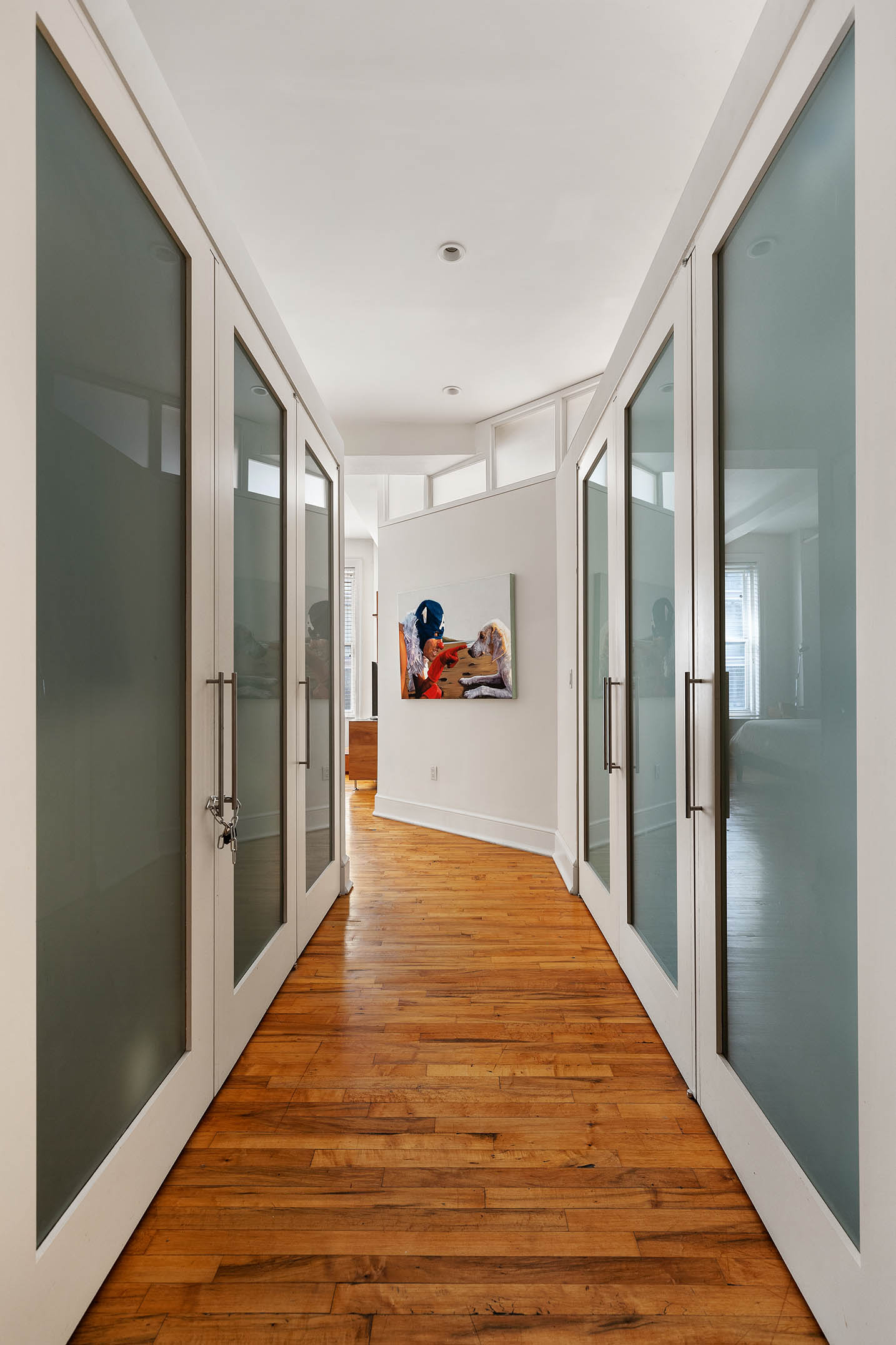 126 West 22nd Street, Unit 5N Manhattan, NY 10011 - Photo 7 of 13 a very nice looking empty room with wooden floor