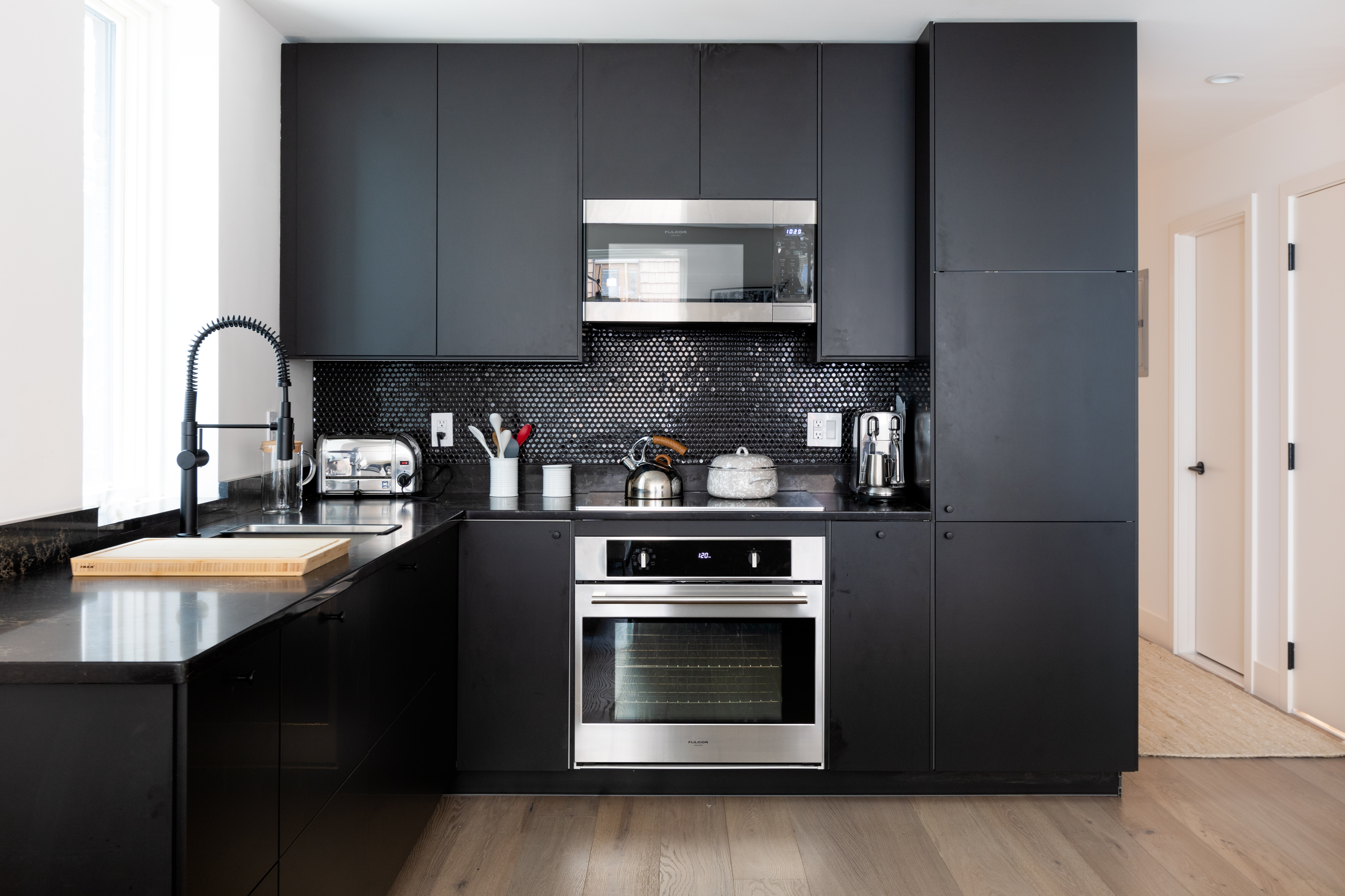 651 Leonard Street, Unit 1A Brooklyn, NY 11222 - Photo 4 of 12 a kitchen with stainless steel appliances a stove a microwave a sink and cabinets