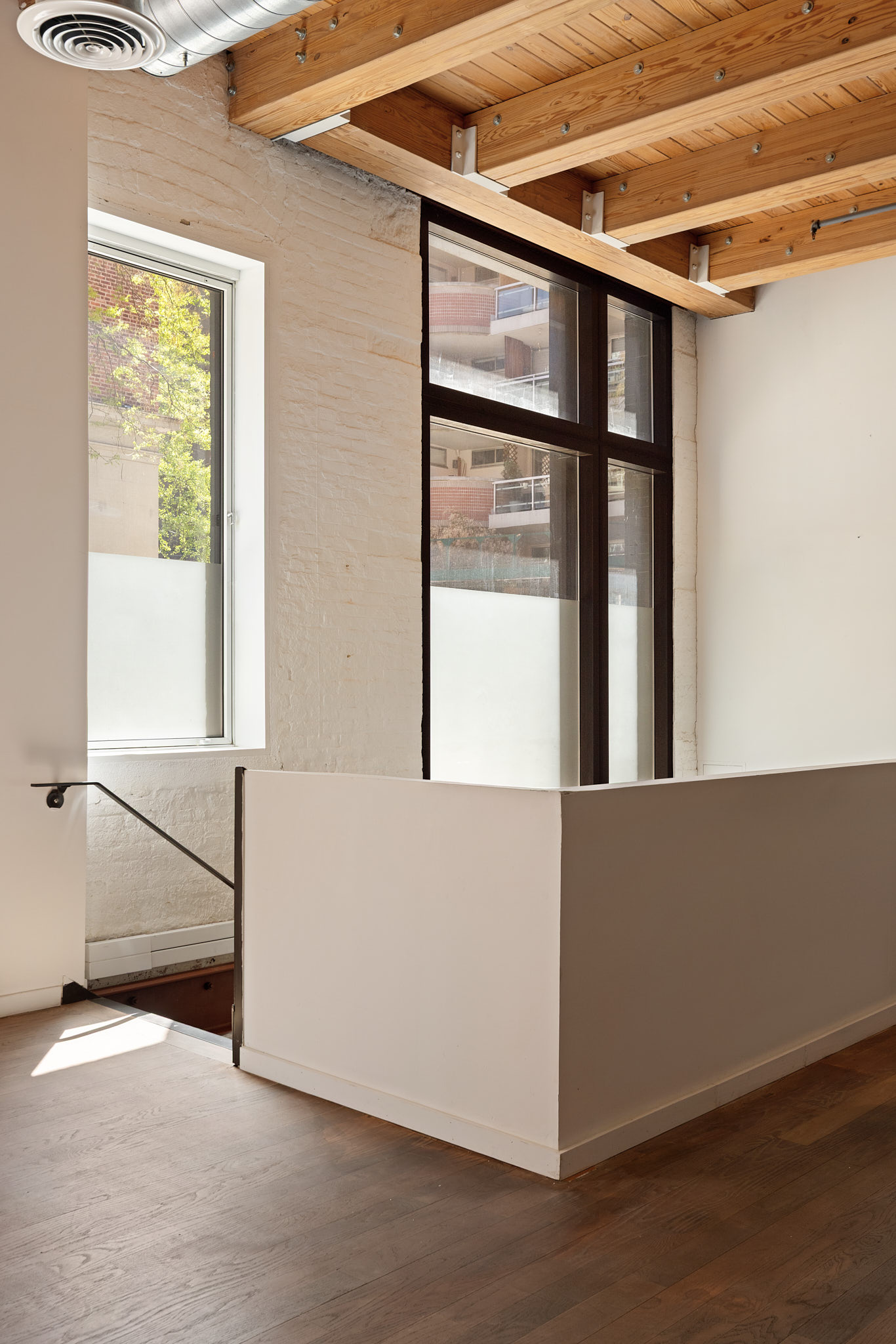 136 Baxter Street, Unit 1B Manhattan, NY 10013 - Photo 4 of 12 a view of an empty room with a window