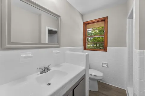 a bathroom with a sink toilet and a bathtub