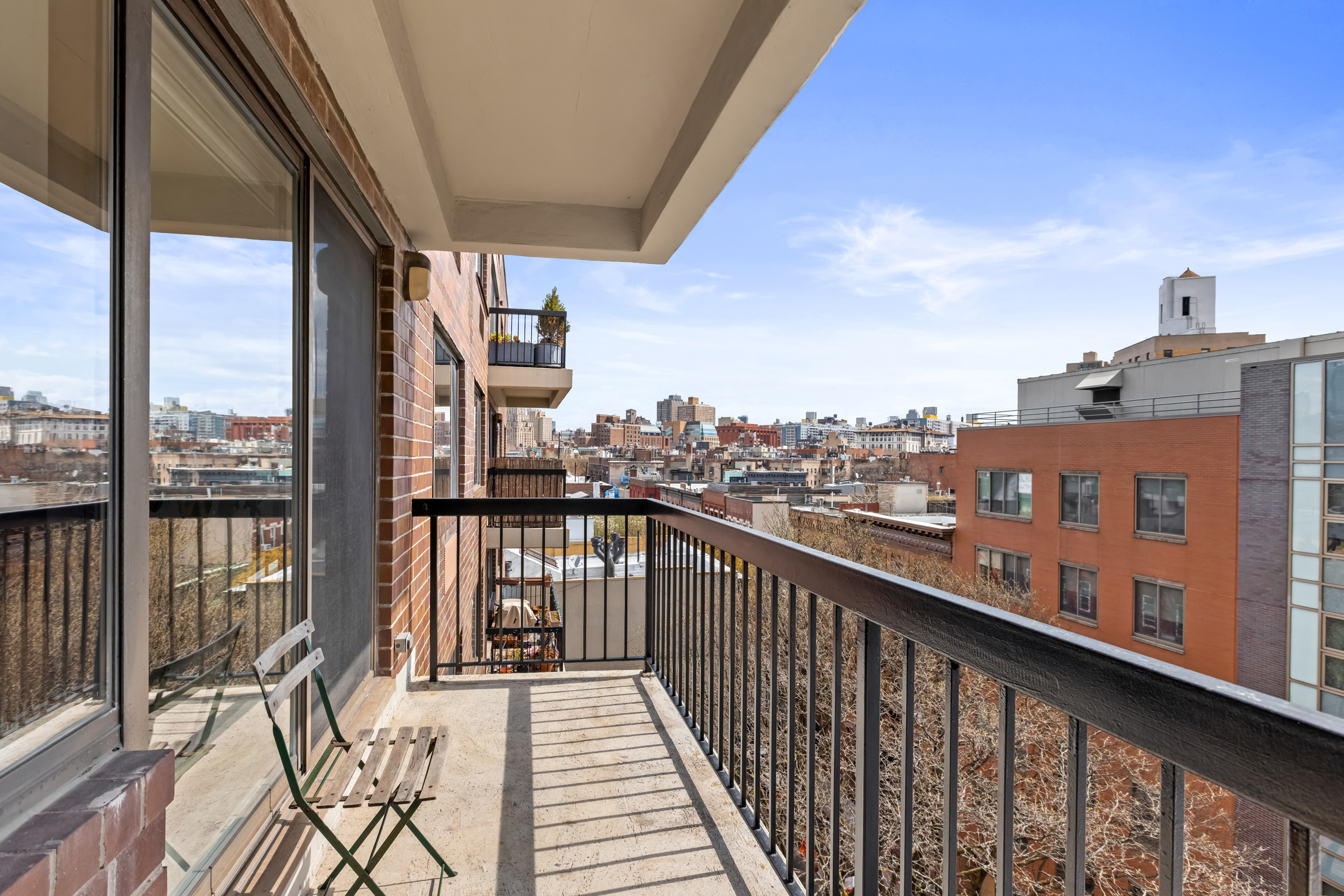 63 Downing Street, Unit 8C Manhattan, NY 10014 - Photo 3 of 15 a view of city from a balcony