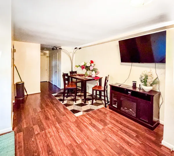 a living room with furniture and a flat screen tv