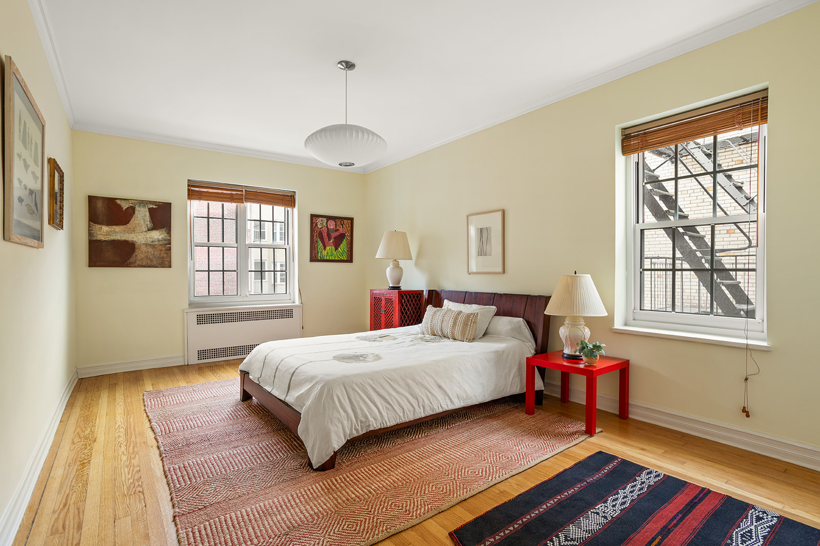 35-24 78th Street, Unit B51 Queens, NY 11372 - Photo 5 of 11 a bedroom with a bed and wooden floor